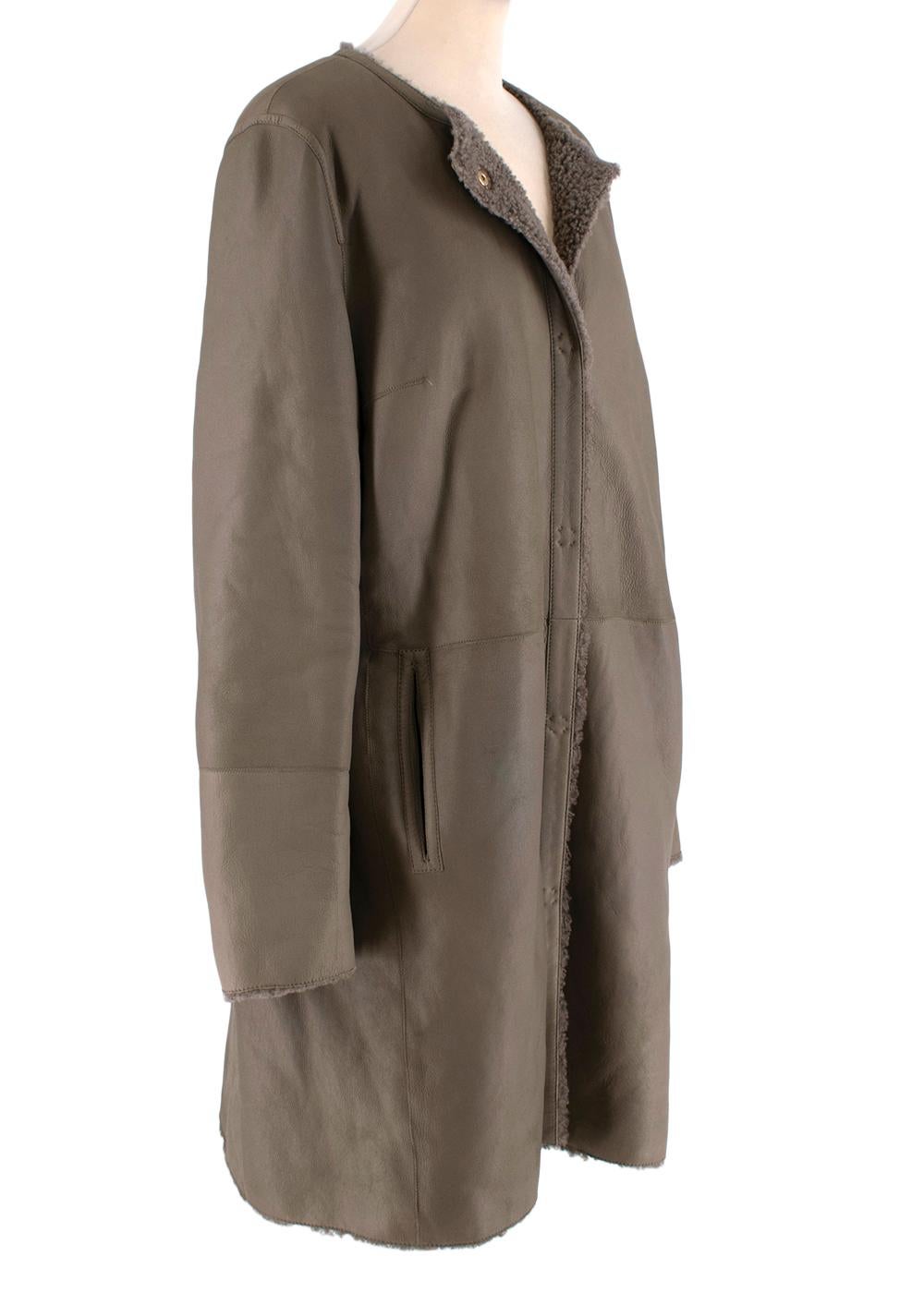 Yves Salmon Grey-Brown Reversible Shearling Collarless Coat

- Fully reversible, popper front style with the option wear shearling facing outwards for a cosy look, or leather-side out, for an elevated and minimal look
- Round neck, collarless