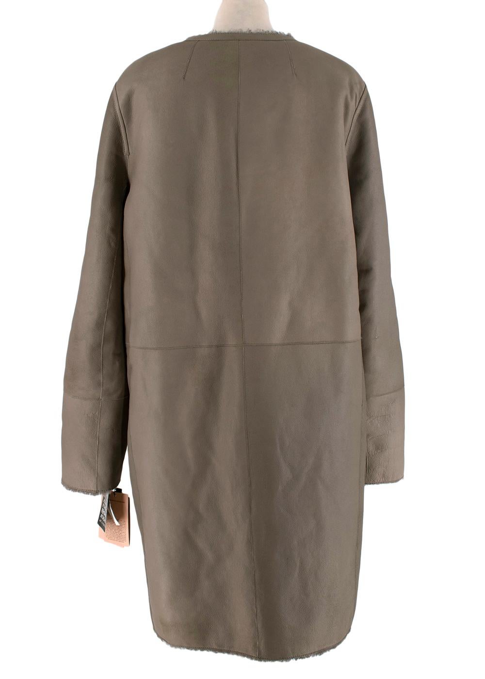 grey collarless coat