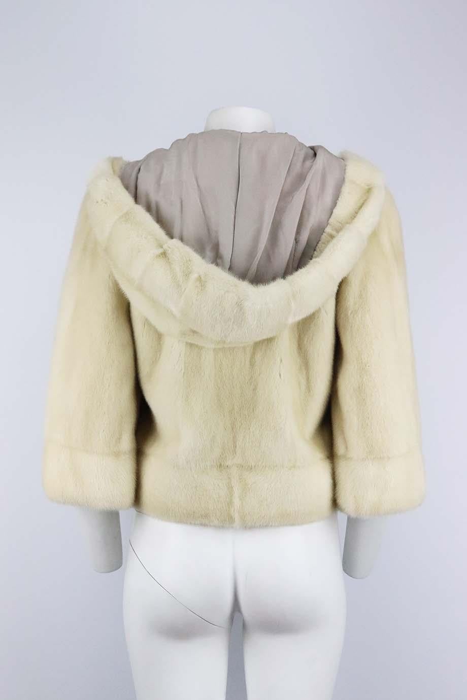 This beautiful Yves Salomon coat is made in a hooded cream slightly cropped silhouette in Paris and has magnetic pockets at front and internal silk lining with hook fastening, this coat is a beautiful investment piece for your wardrobe. Cream