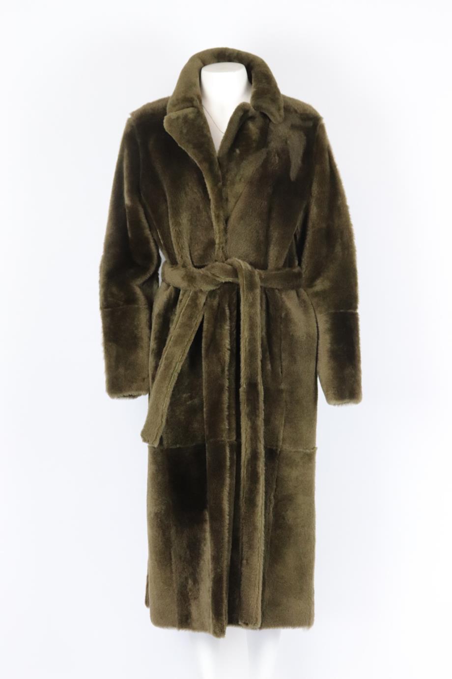 Yves Salomon reversible shearling coat. Green. Long sleeve, v-neck. Belt fastening at front. 100% Leather; fabric2: 100% lamb. Size: FR 42 (UK 14, US 10, IT 46). Shoulder to shoulder: 17.5 in. Bust: 45 in. Waist: 42 in. Hips: 48 in. Length: 48 in.