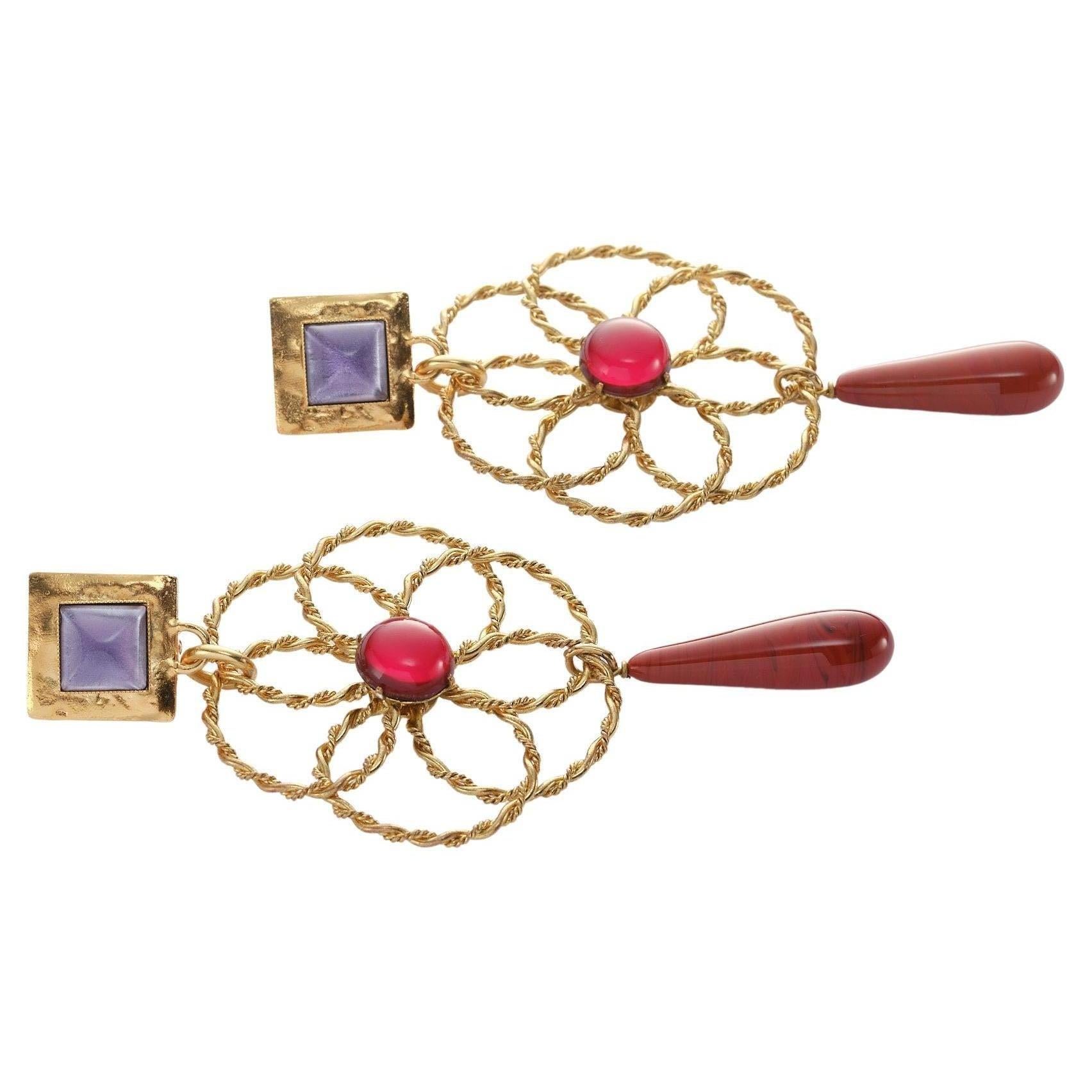 A unique ear clip from YSL Paris designed by Roger Scemama Pairs in the 1980s. 
Measurement: The full length of the ear clip 12 cm, 
The upper rectangular clip part  2 x 2 cm, the Scemama Flower 6 cm diameter, the attached drop 6 cm long. Excellent