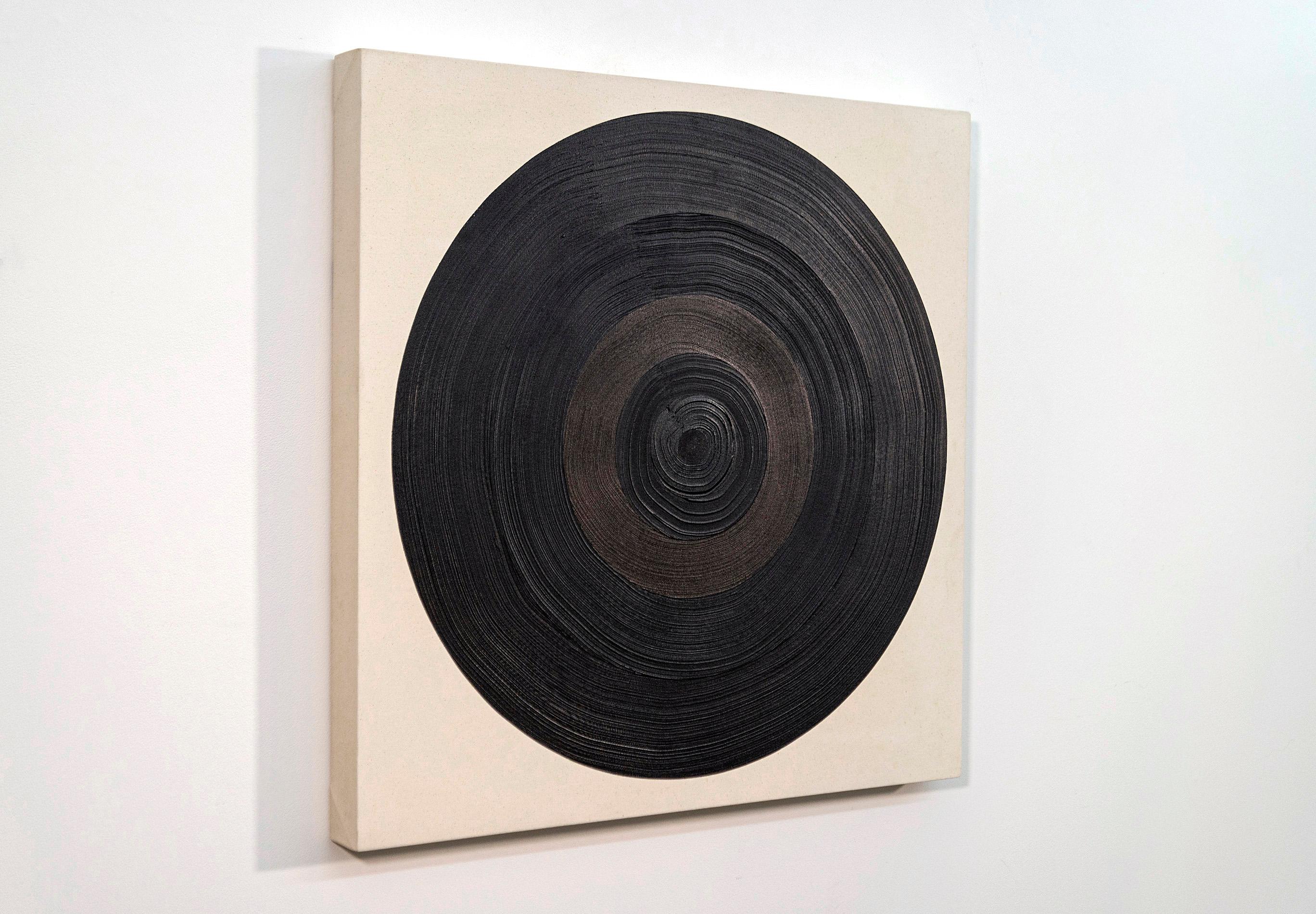 With its bold form and striking black palette, this large circular painting by Yvonne Lammerich makes a dramatic contemporary statement. A close examination of this work reveals circles within circles emanating from a defined target. Lammerich is
