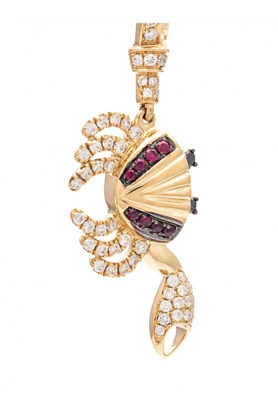 Earring in 18K Yellow Gold 5,2 gr
Diamonds 0,40 carats 
Ruby 0,10 carats 
Black Diamonds 0,04 carats 
Sold by Unit
Alpa System
