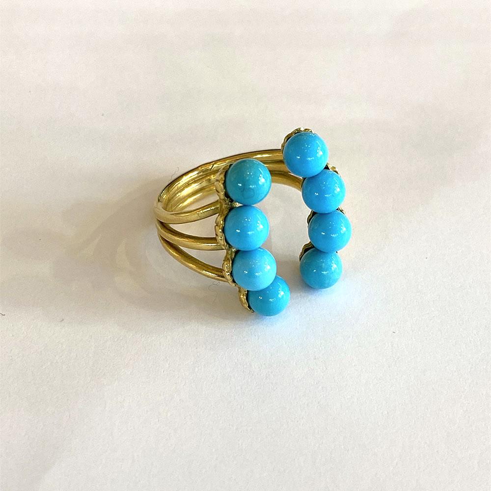 Ring in 18K Yellow Gold 8gr approx.
8 Turquoises size 5/5,5
Can be put at size
