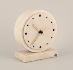 Yxhult Sten, Sweden. Tabletop clock in white marble with brass hands