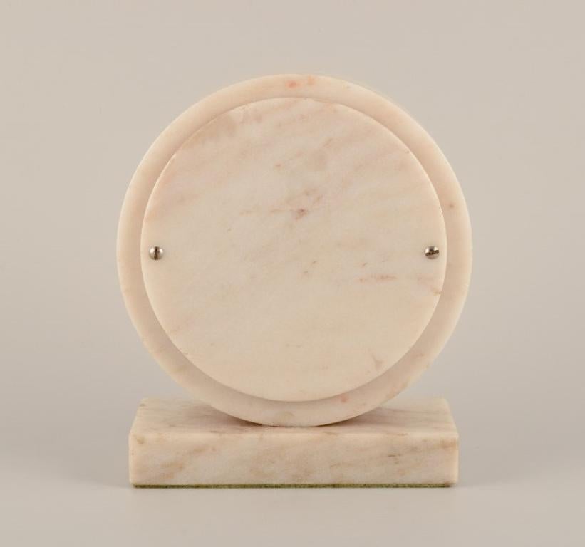 Brass Yxhult Sten, Sweden. Tabletop clock in white marble with brass hands