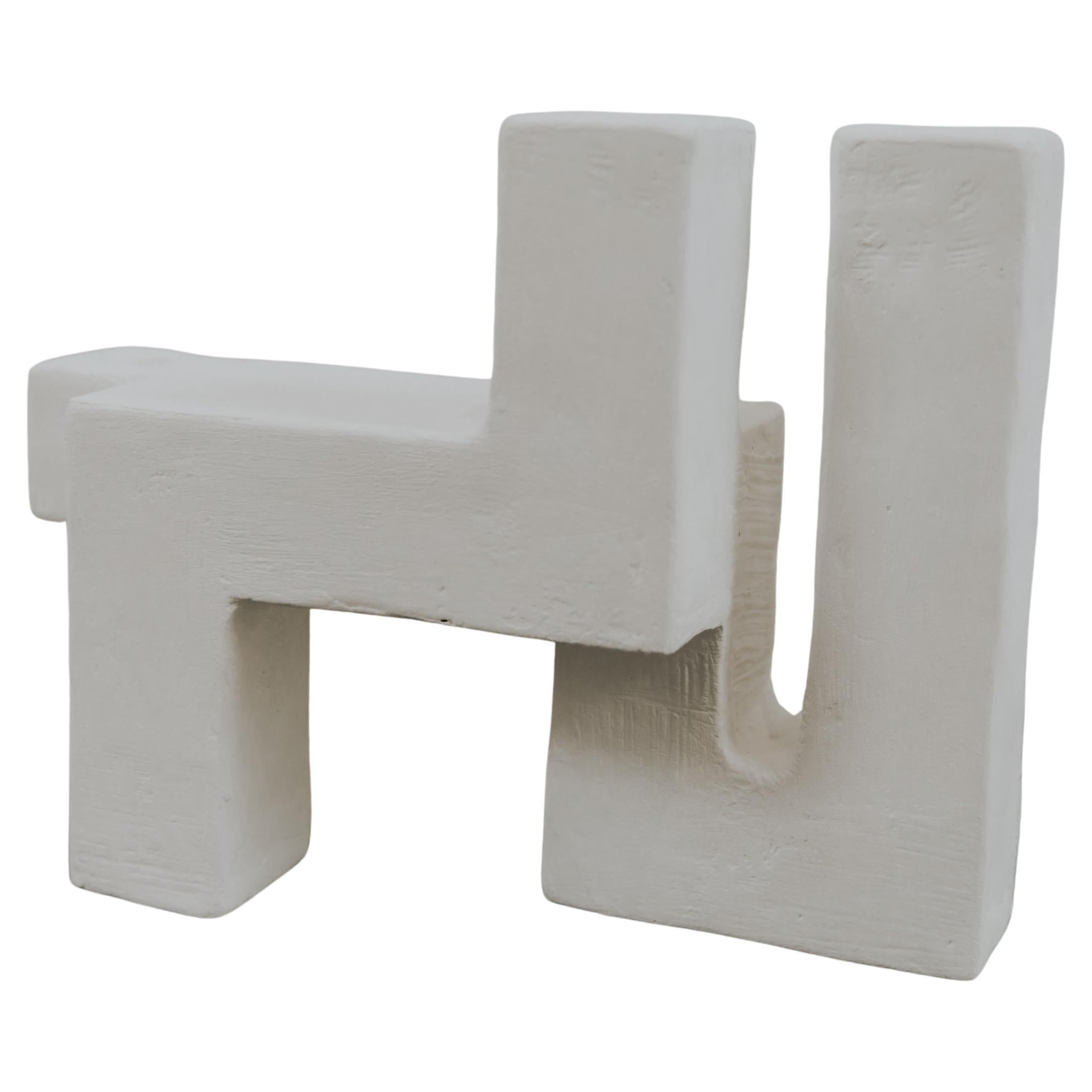 An abstract take on the letters X, Y, and Z, this collection of three candle holders is an elegant addition to any living room or dining table. With its organic but monolithic curves and clean texture, these hand-sculpted candle holders are made