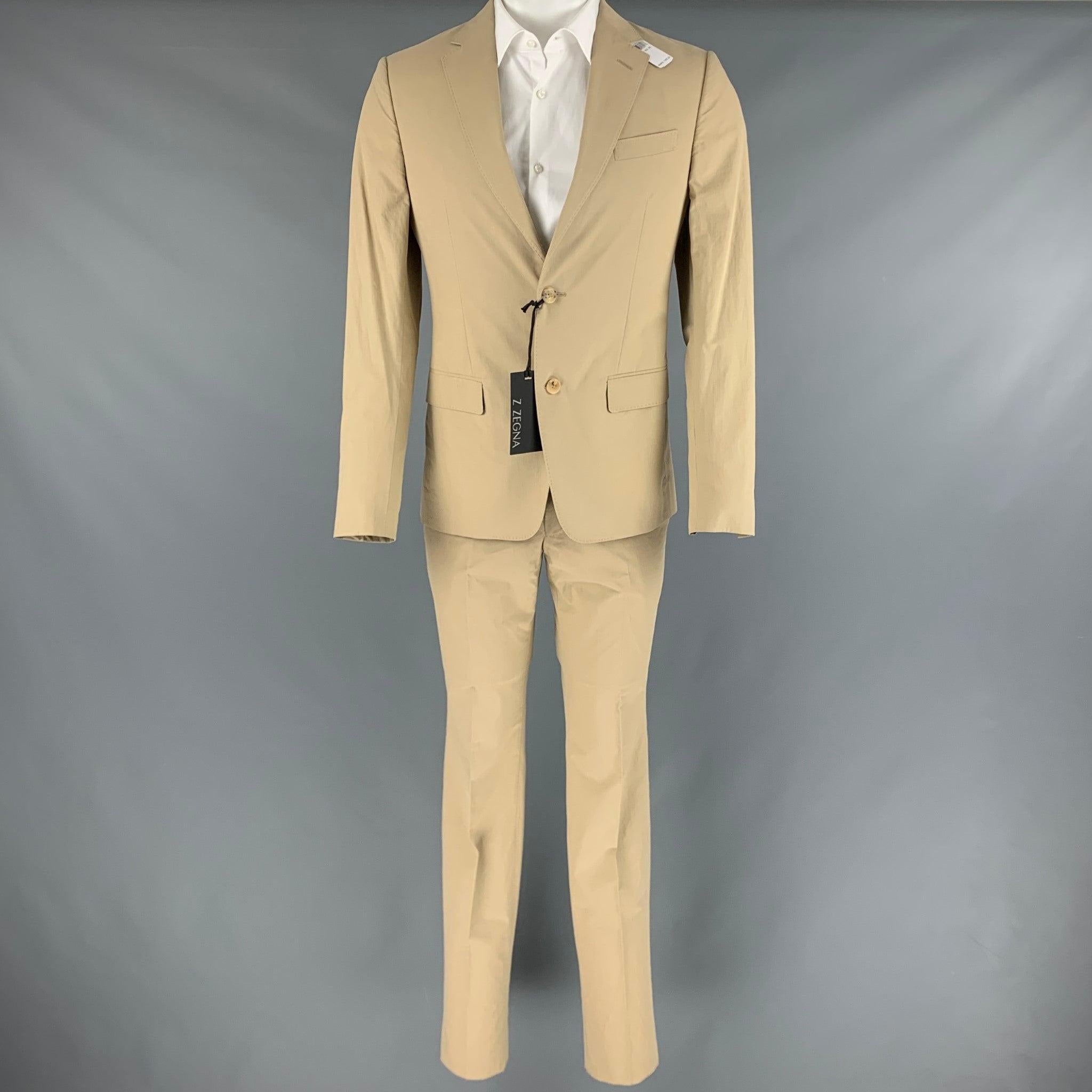 Z ZEGNA suit
in a khaki cotton with a full liner and includes a single breasted, double button sport coat with notch lapel and matching flat front trousers.New with Tags. 

Marked:   36R 

Measurements: 
  -JacketShoulder: 16.5 inches Chest: 36