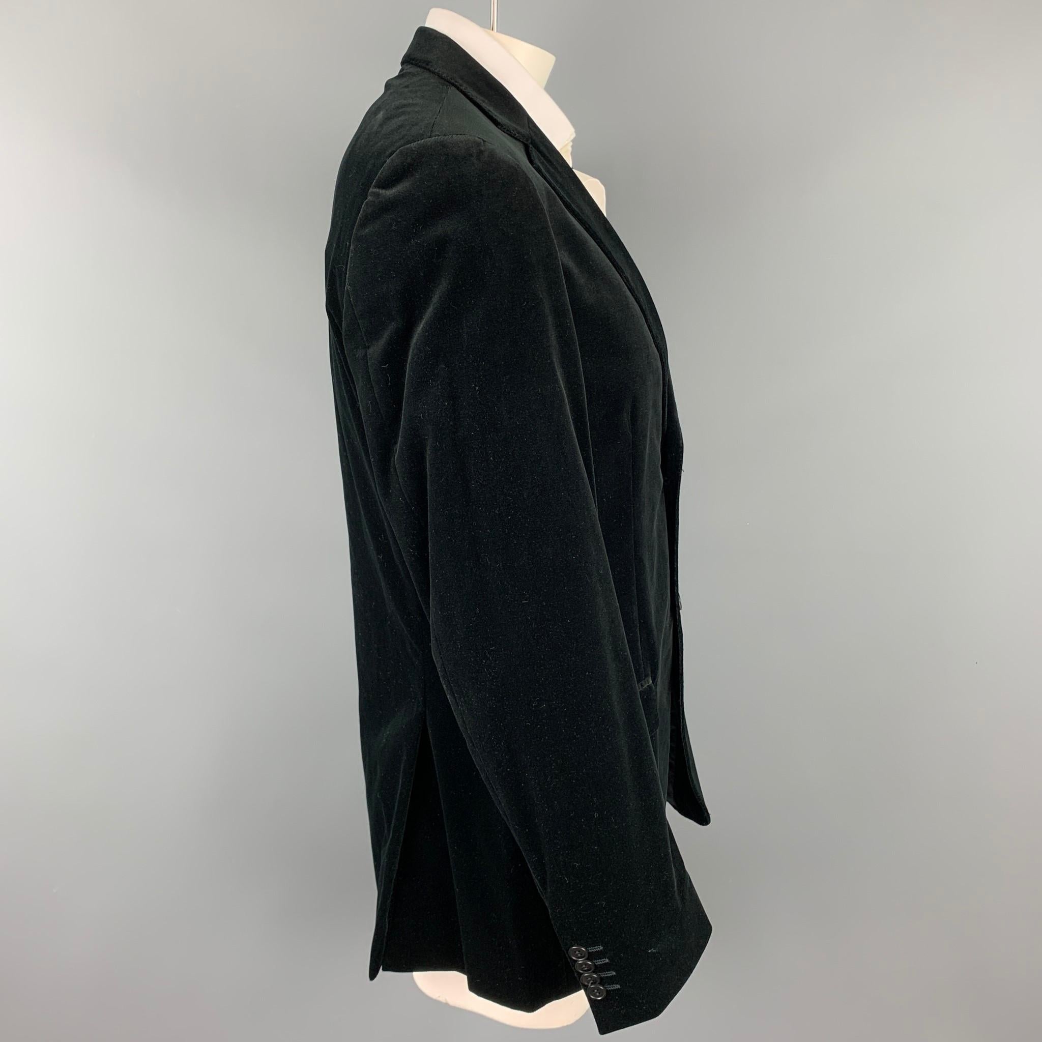 Z ZEGNA sport coat comes in a black cotton velvet with a full liner featuring a notch lapel, flap pockets, and a two button closure.

Very Good Pre-Owned Condition.
Marked: 54 L

Measurements:

Shoulder: 19 in.
Chest: 44 in.
Sleeve: 27.5 in.
Length: