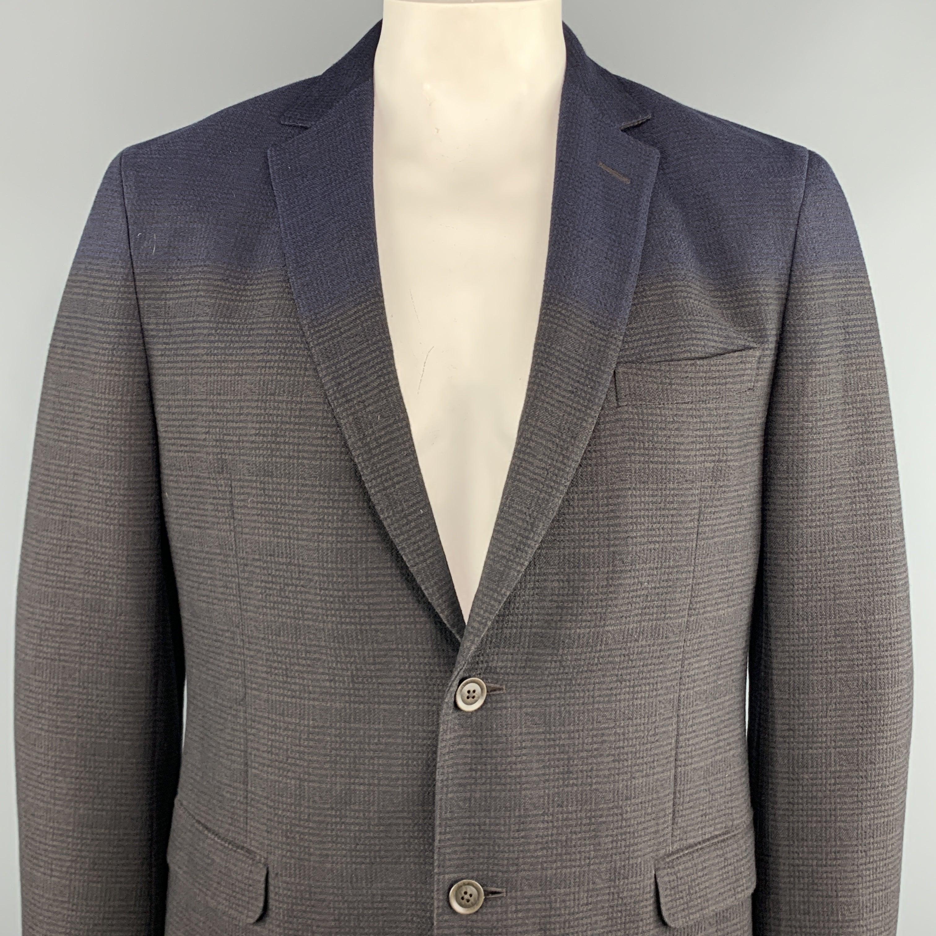 Z ZEGNA Sport Coat comes in a brown & navy plaid cotton / wool featuring a notch lapel, ombre effect, flap pockets, and a two button closure.
Excellent
Pre-Owned Condition. 

Marked:   54 R 

Measurements: 
 
Shoulder: 19 inches 
Chest: 44 inches
