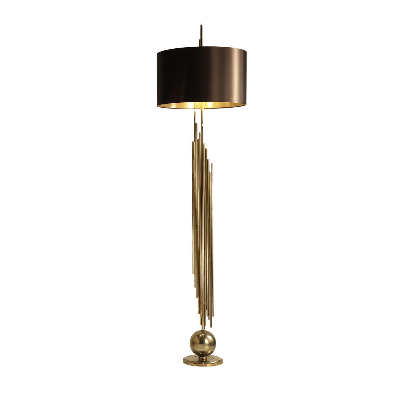 This floor lamp will bring a touch of luxury into the home or office and will elegantly complement any decor. The flat circular base is topped with a spherical element with a configuration of tubular structures. Every component of this lamp was