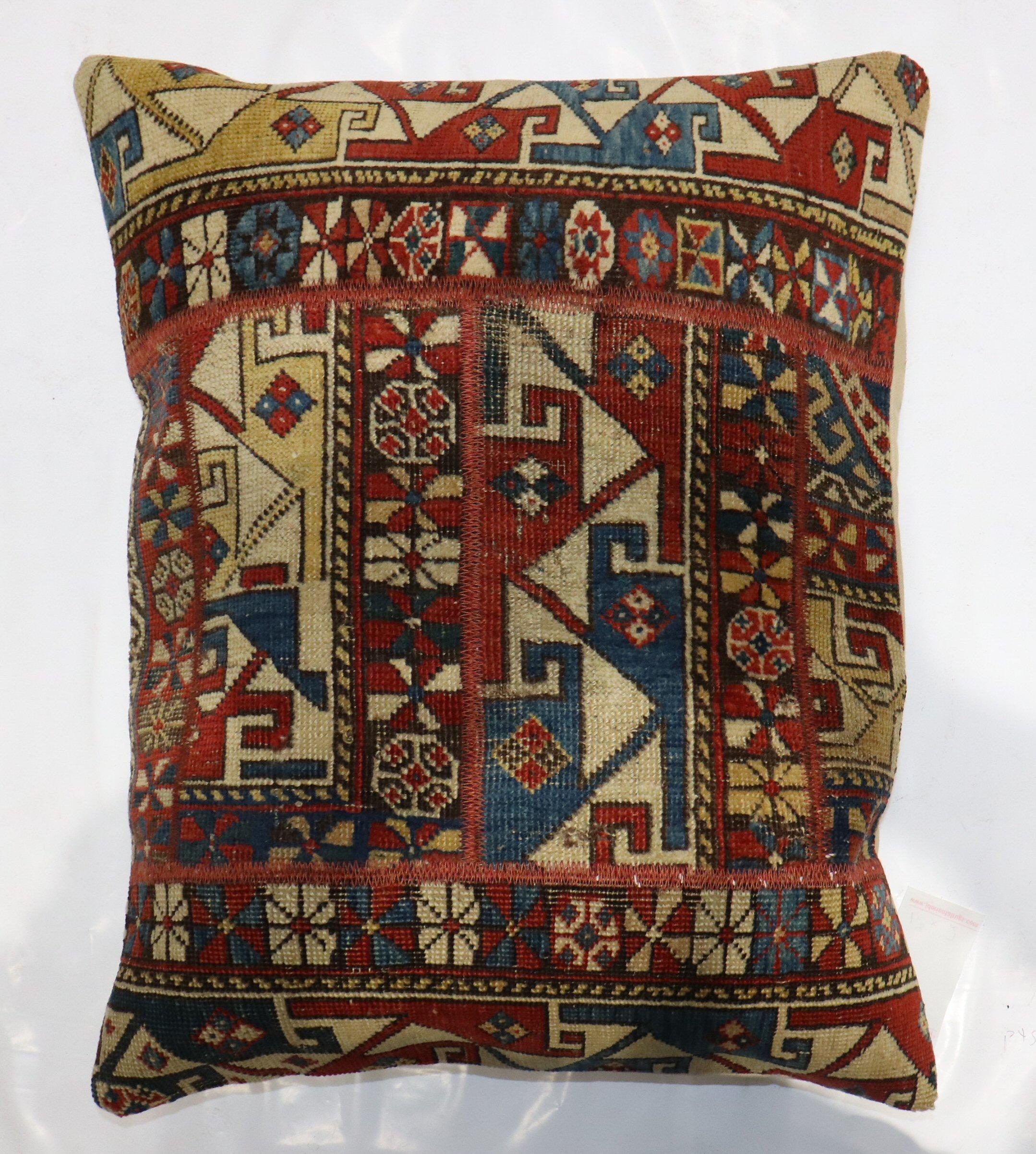 Pillow made from a 19th-century Caucasian rug  with cotton back and zipper closure included.

Measures: 20'' x 24''.