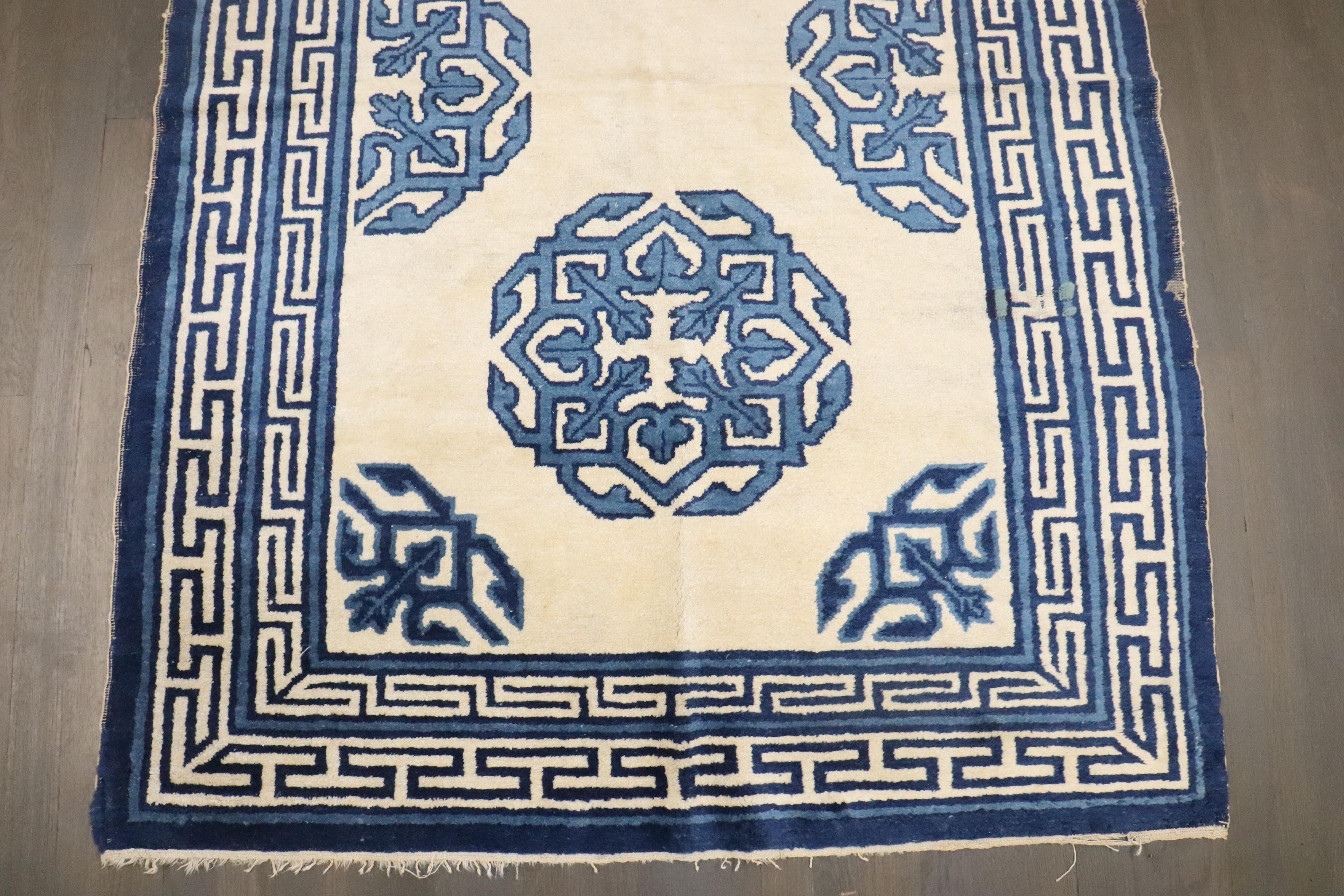 a 19th-century ivory and Blue Chinese Peking Carpet

Details
rug no.	10823
size	4' x 5' 9