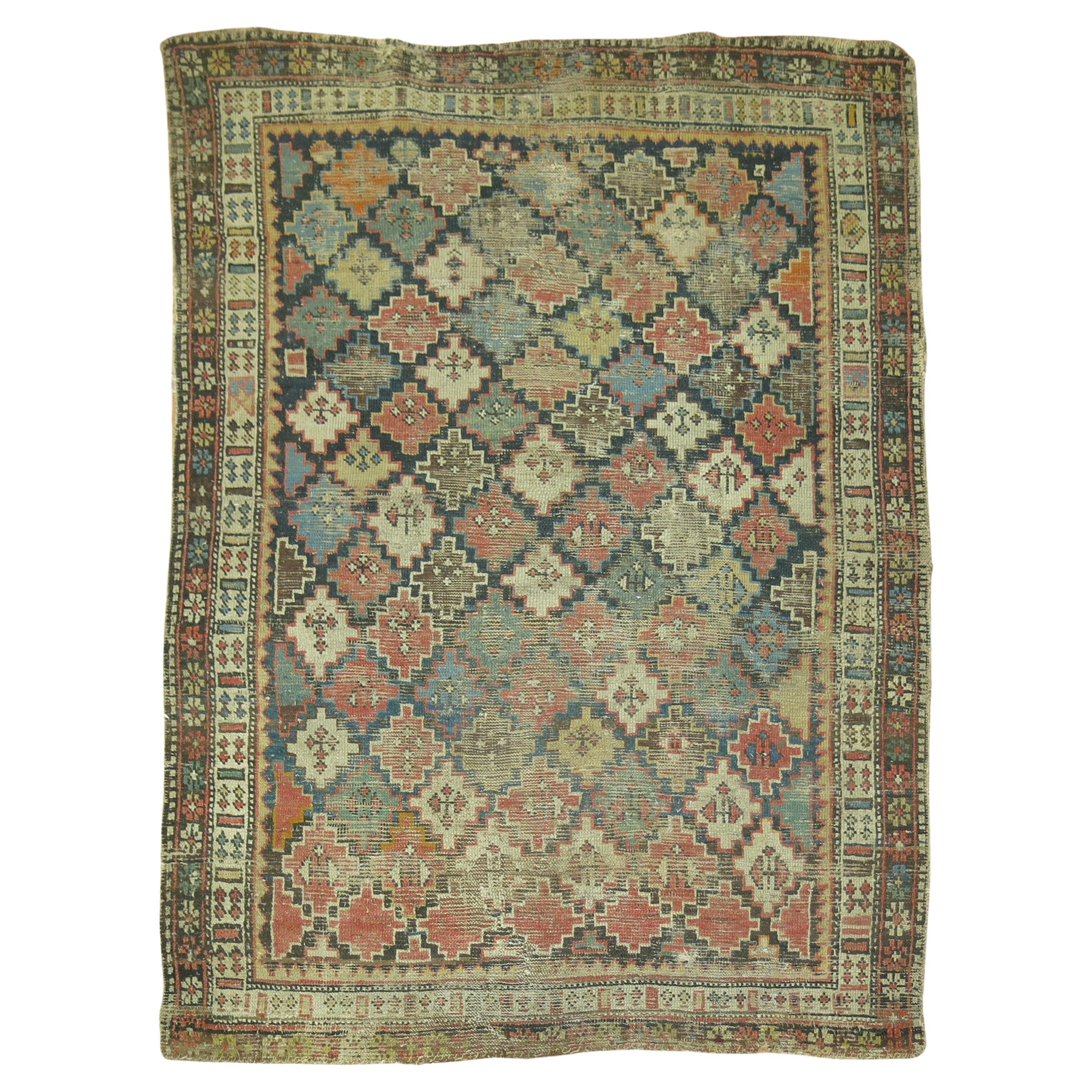 Zabihi Collection 19th century Distressed Antique Caucasian Rug For Sale