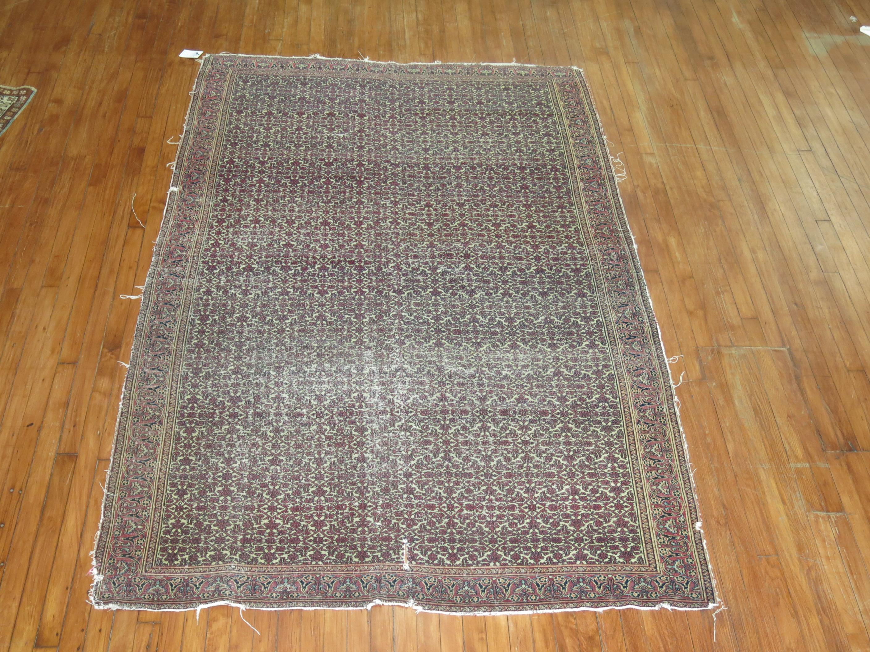 A naturally distressed Persian doroksh rug 

circa 1875, measures: 5'4