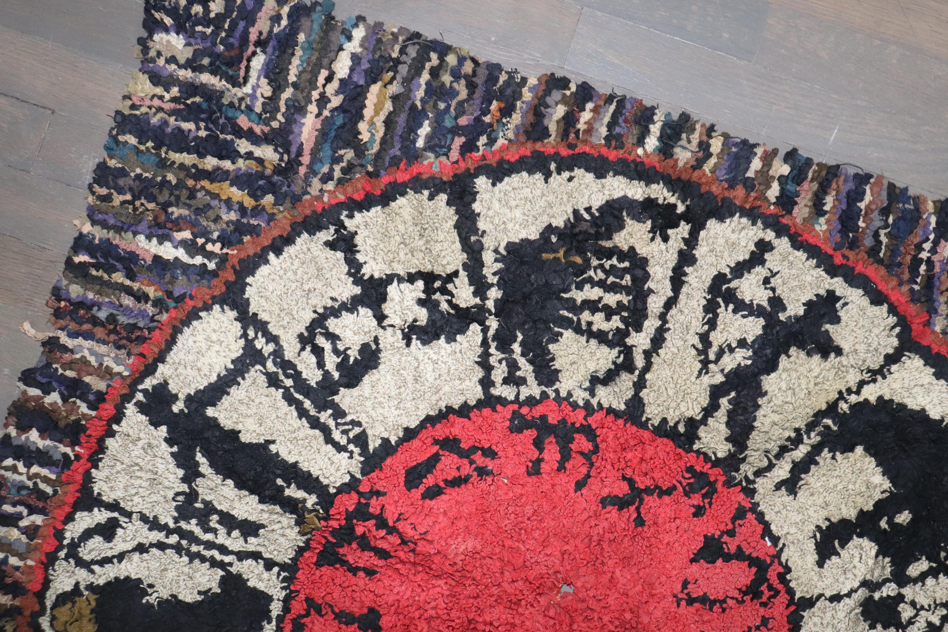 a wild mid-20th century hooked rug featuring a zodiac horoscope pattern

Details
rug no.	j4034
size	3' x 3' 2