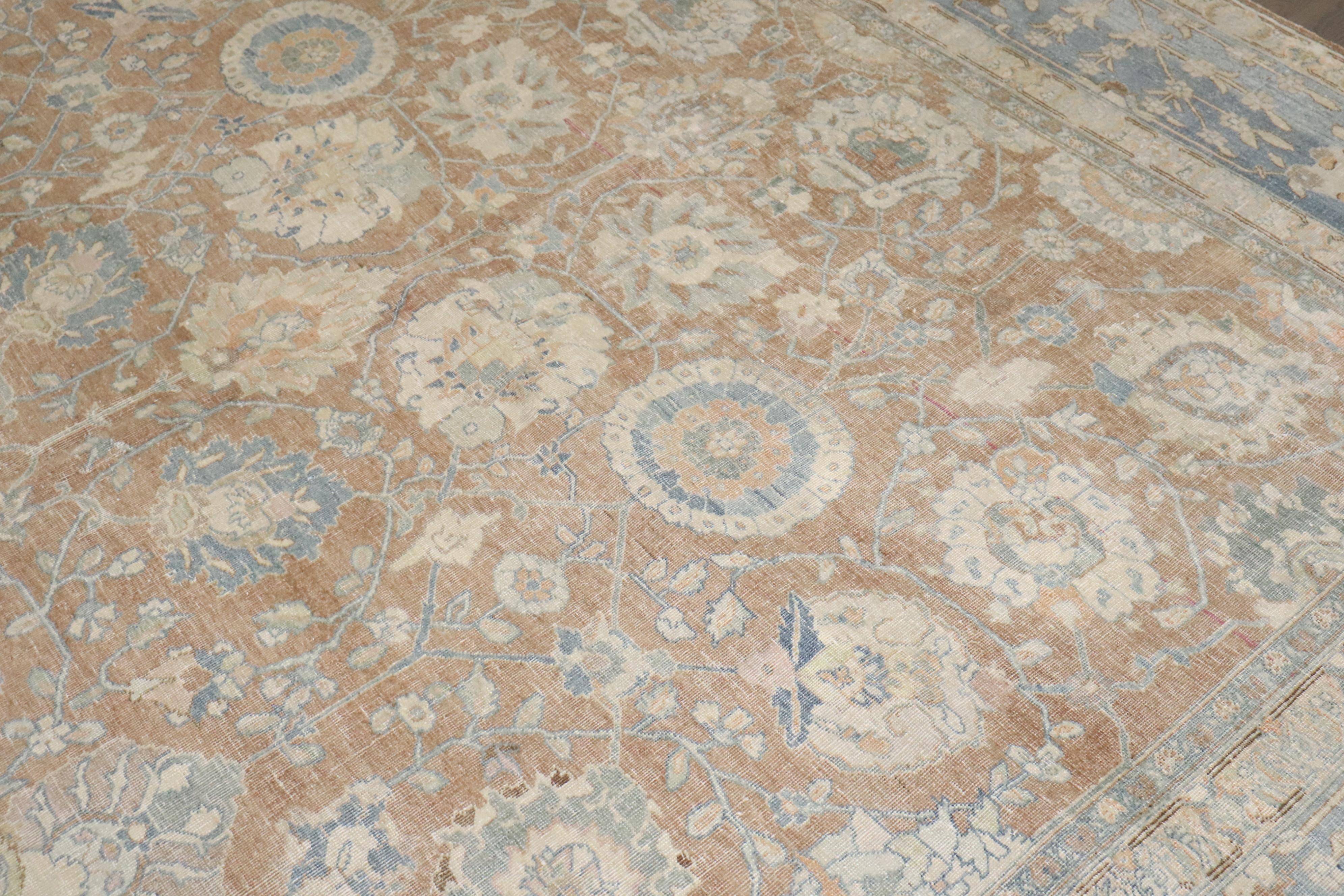 A room size early 20th century Persian Tabriz rug in soft browns, soft blues and creams

Details
rug no.	j3807
size	10' x 12' 2