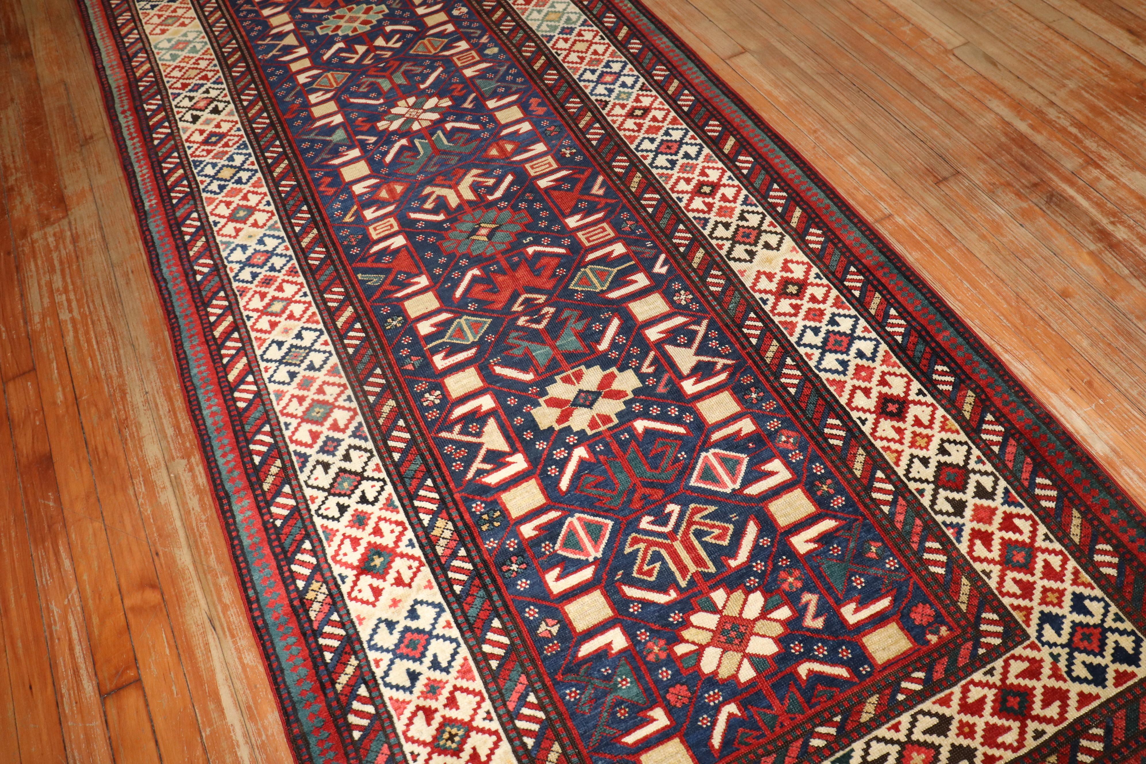 19th century kuba shirvan antique runner  with a tribal pattern  on a navy color field

Measures: 3'11'' x 12'1''.