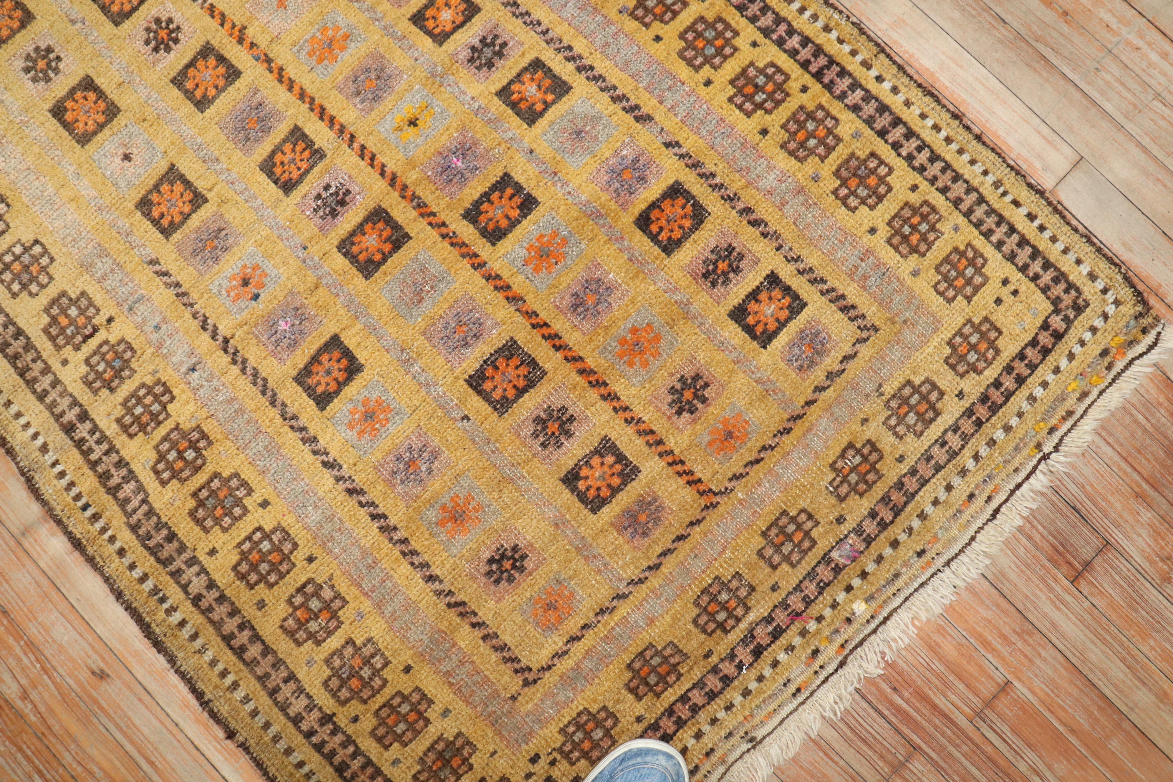 Rustic Zabihi Collection Antique Mustard Color Baluch Rug For Sale