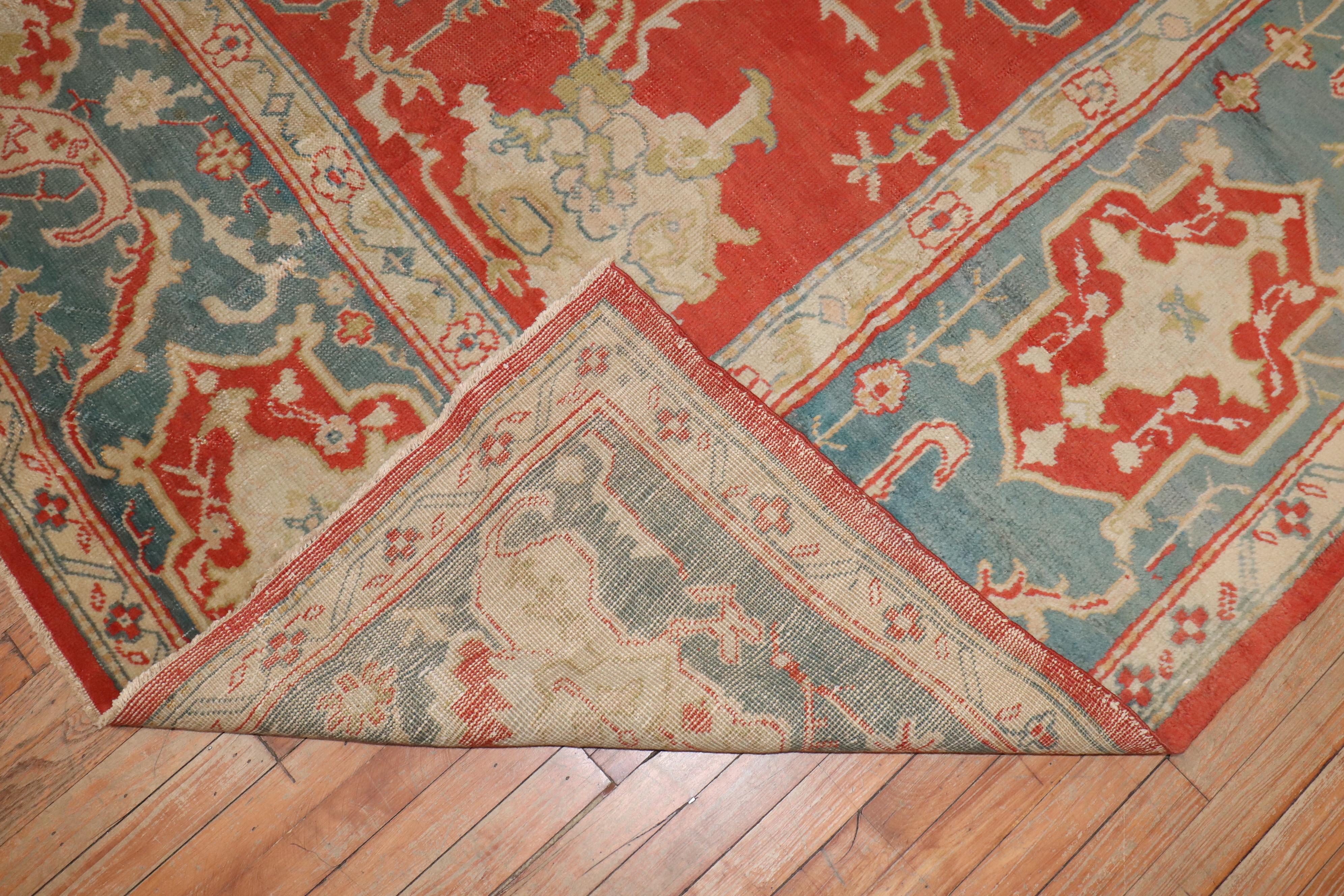 An early 20th-century antique Oushak carpet

Measures: 9'11” x 13'5”.