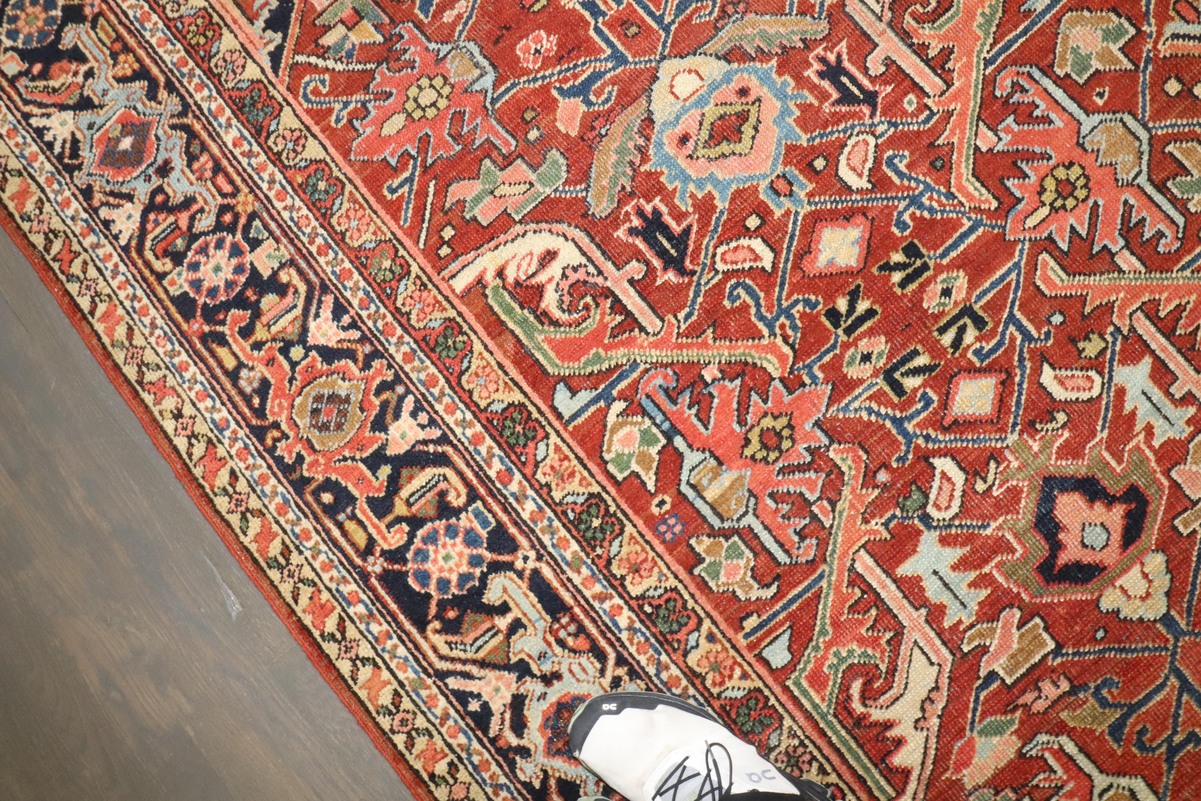 An early 20th-century Persian heriz small room-size rug. 

Measures: 7'6'' x 10'10''

Heriz carpets are beloved for their versatility. Their geometry complements modern furnishings and their warm colors and artistic depth enhance antiques of all