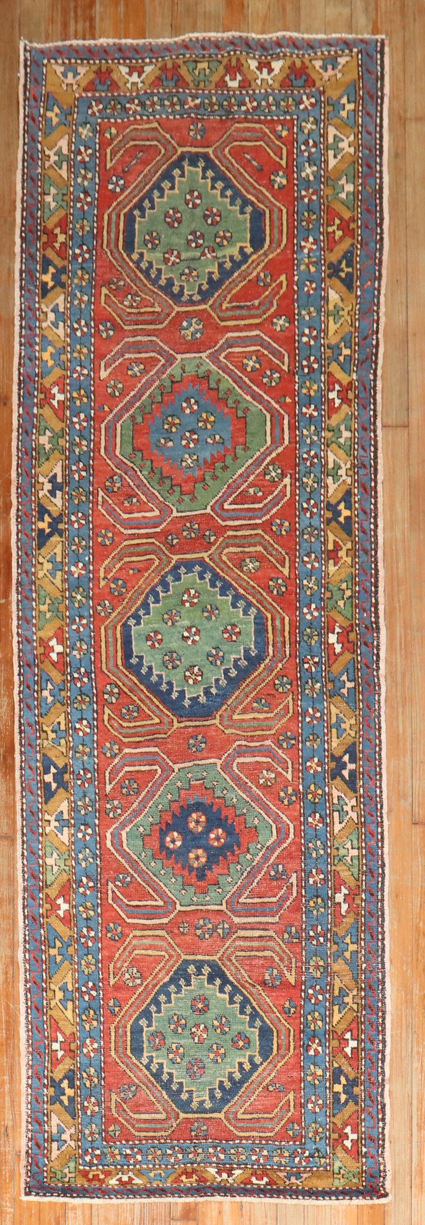 Colorful antique Persian Heriz runner from the 2nd quarter of the 20th century with an all-over geometric motif 

2'7'' x 8'10''