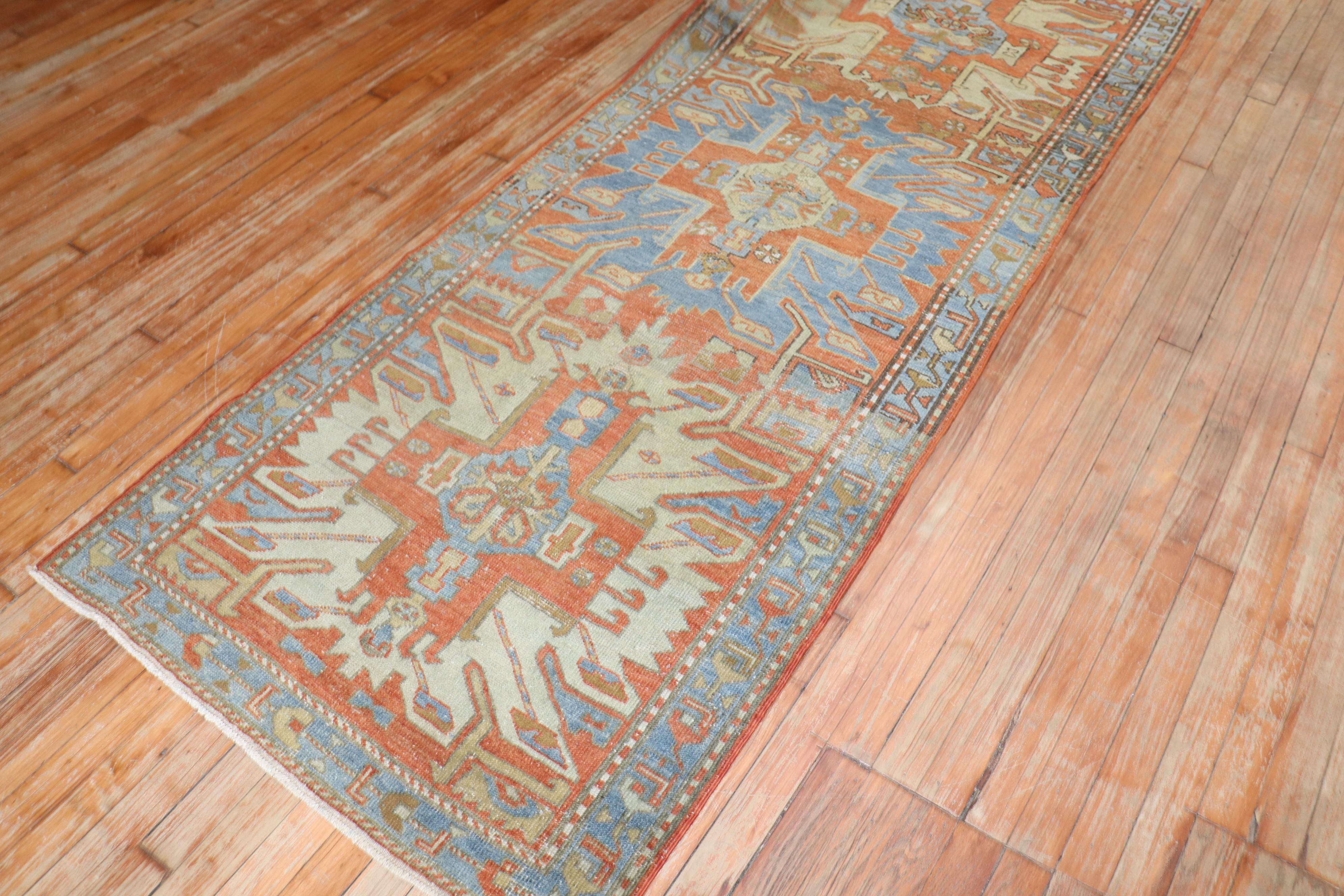 an early 20th Century Persian Heriz Runner with a geometric Lenkoran pattern found in many 19th century Caucasian Kazak Rugs

3' x 10'7''