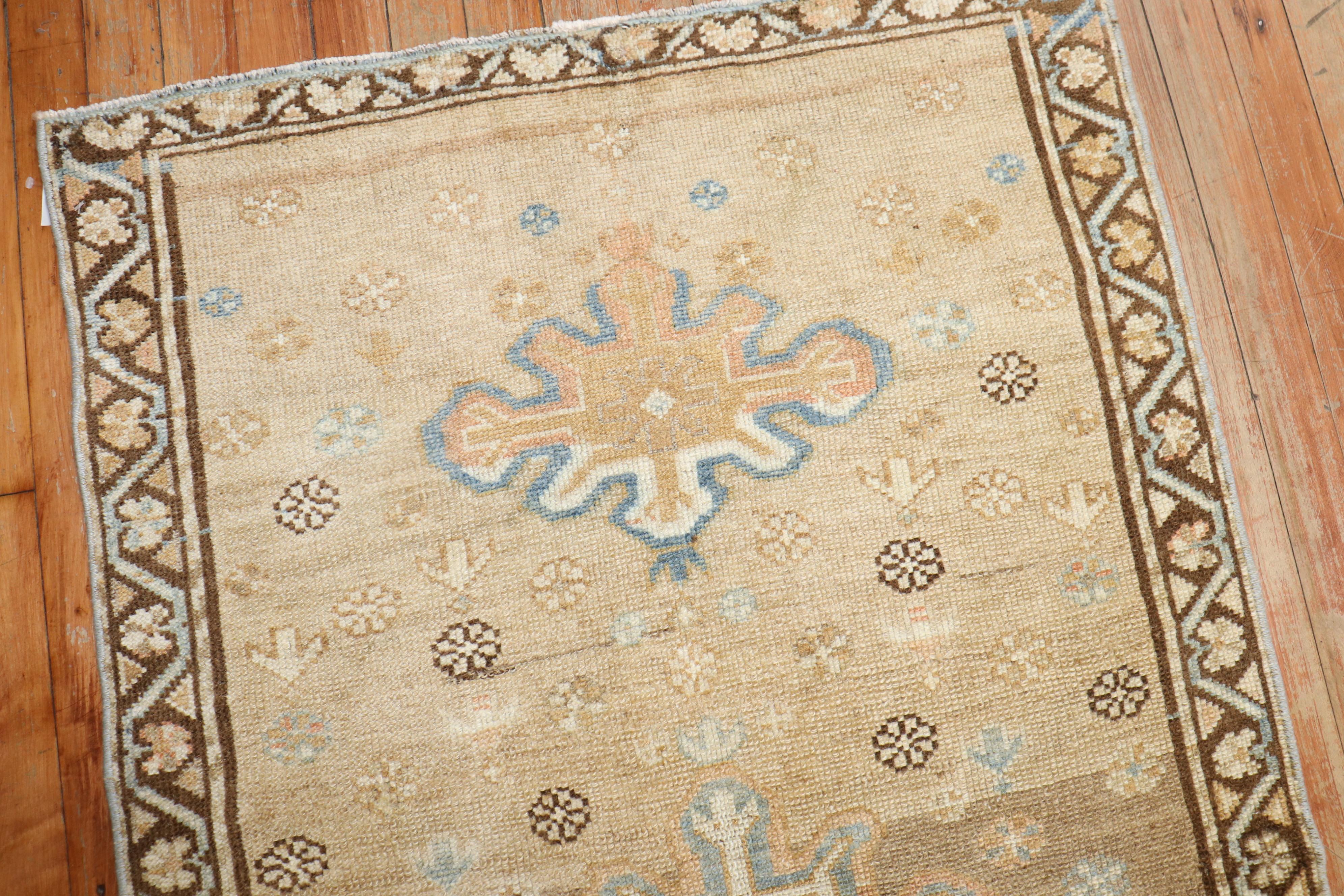 an early 20th century persian serab light camel field scatter size rug

Measures: 2'8'' x 4'7''