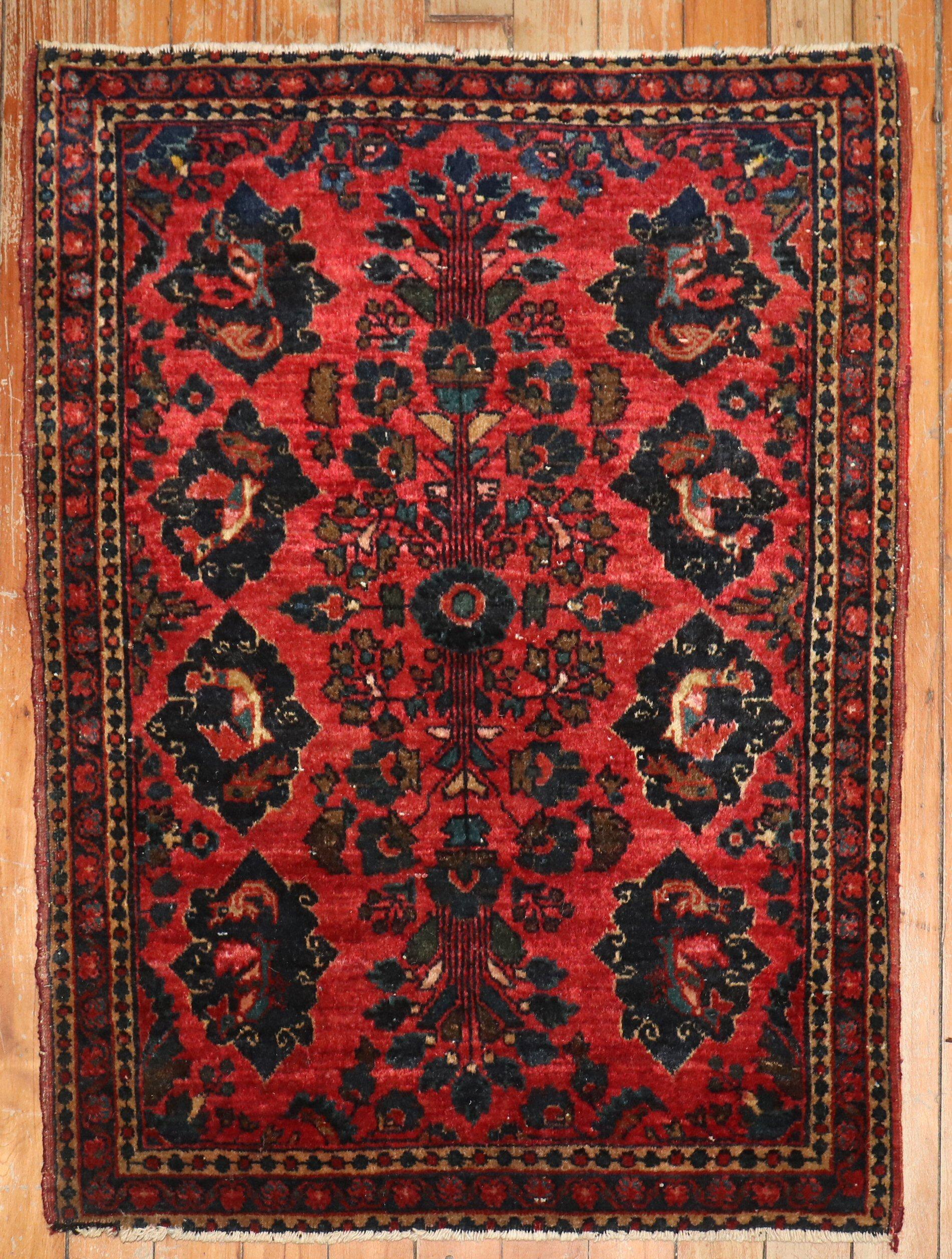1920s Persian Sarouk mat-size rug with small turkeys and fish swarming in navy palmettes on a red ground

1'10'' x 2'6''
.