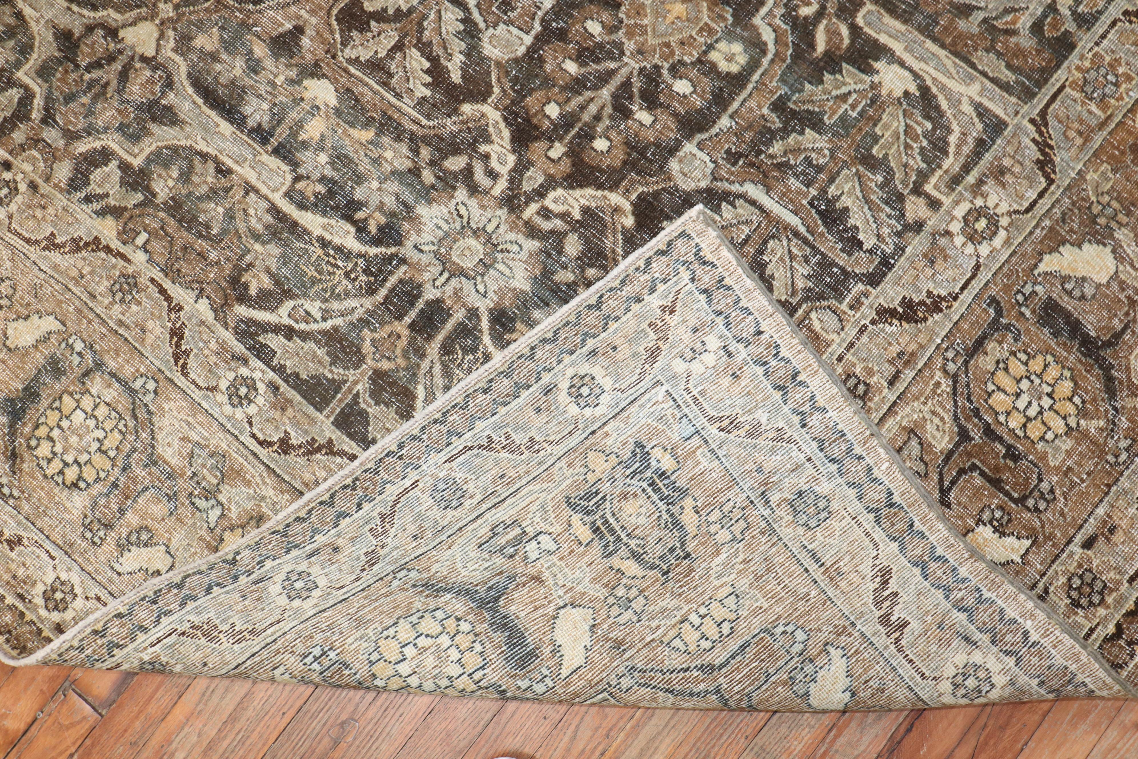 An antique Persian Tabriz Rug in brown and charcoal from the 1st quarter of the 20th century

Details
rug no.	j2721
size	9' x 12' 1