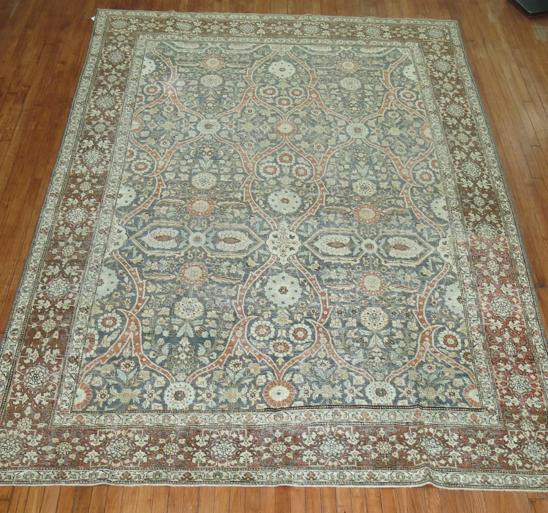 An early 20th century highly decorative Persian Tabriz rug 

Measures: 8'1'' x 11'4''