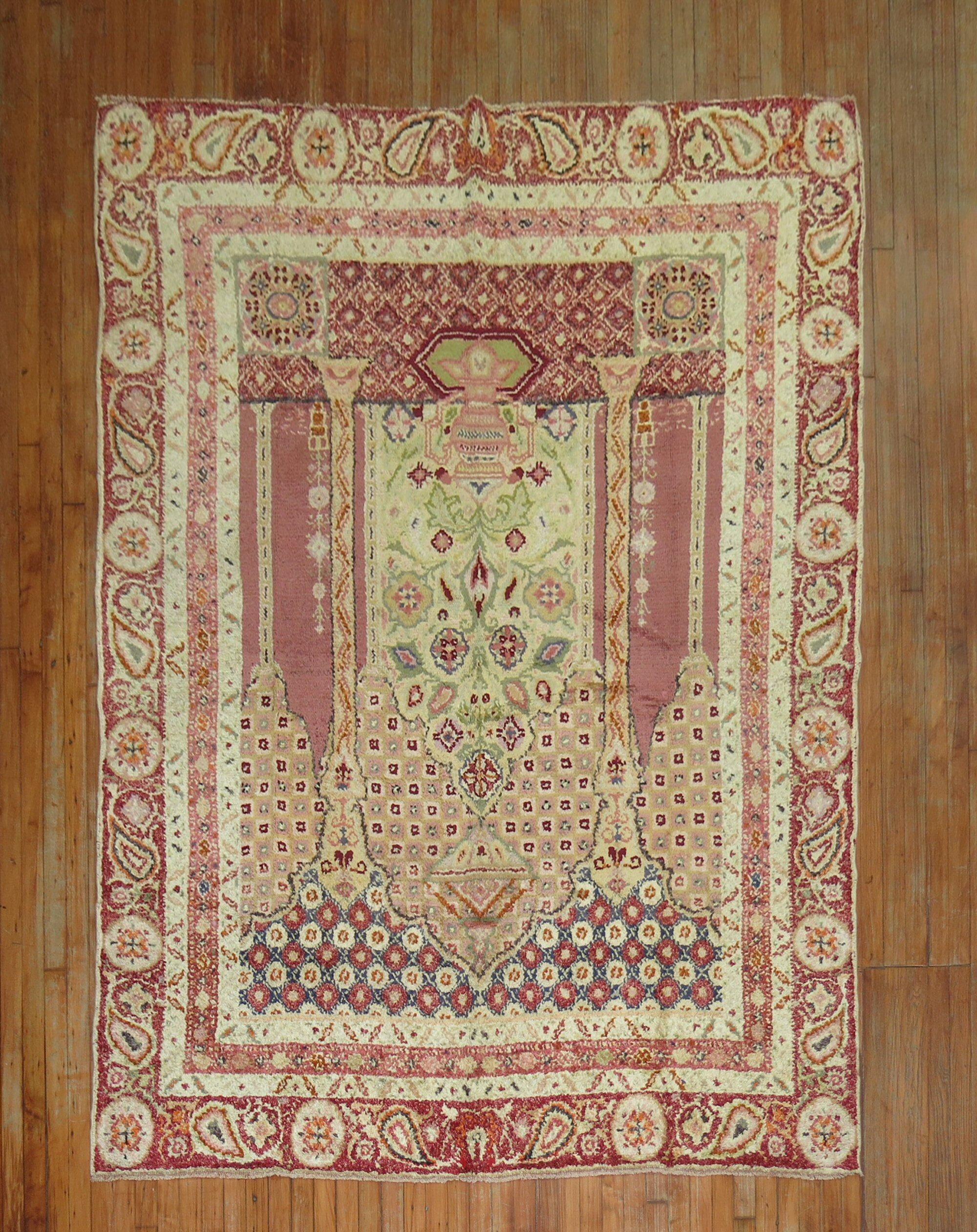 an early 20th-century intermediate-size Turkish Ghiordes rug with a scroll prayer niche design commonly found in smaller scatter and accent sizes. A statement rug in itself

Measures: 6'6'' x 8'6''.
