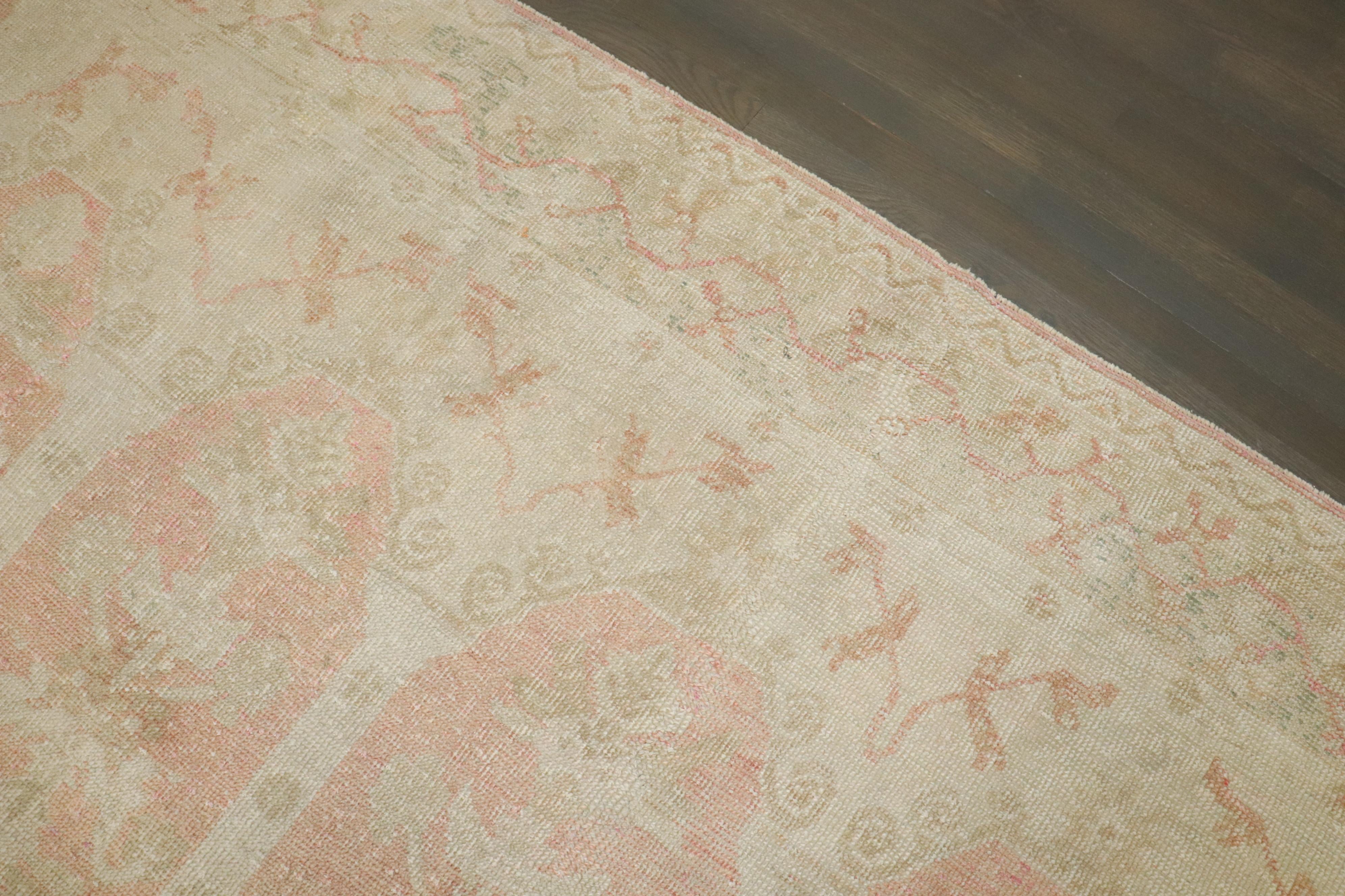 20th Century Zabihi Collection Antique Turkish Ghiordes Soft Pink Gallery Corridor Rug For Sale