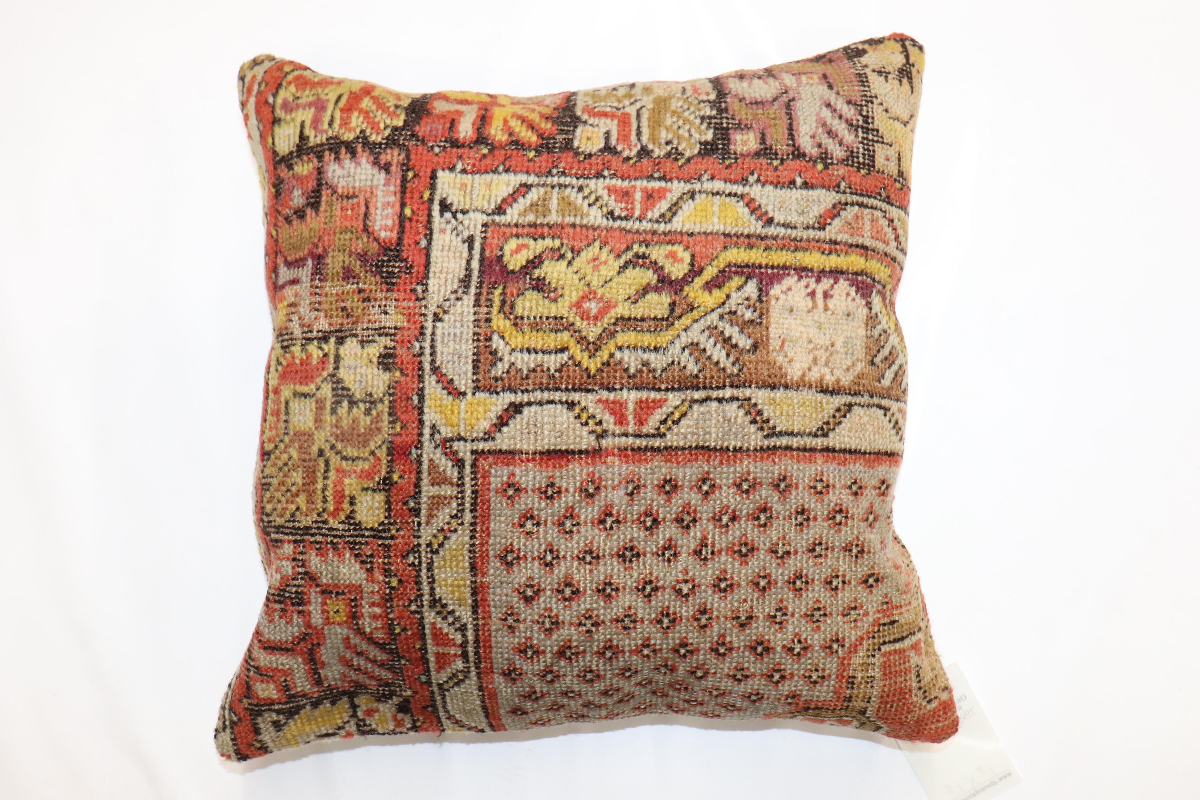 Pillow made from an early 20th century turkish rug. 

Measures: 17'' x 17''
