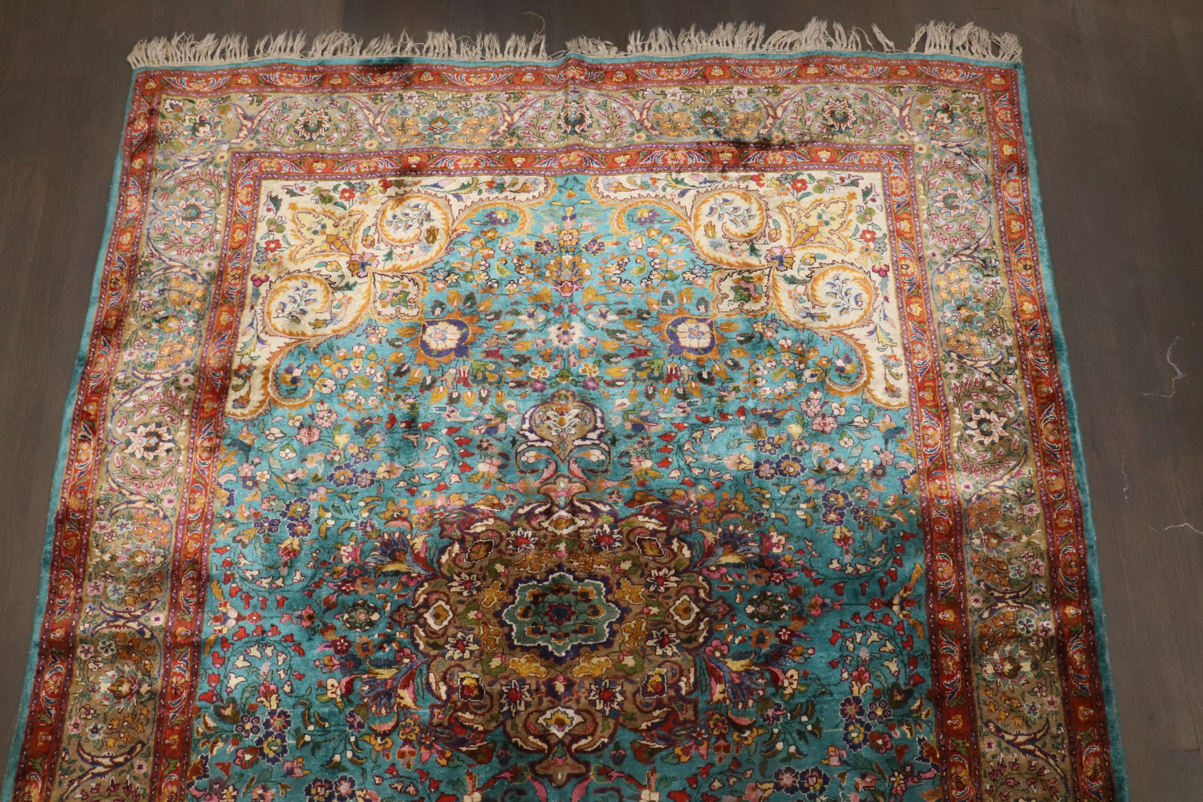 an early 20th century formal Silk Kashan Rug featuring a rare turquoise color background

Details
rug no.	10749
size	4' 8