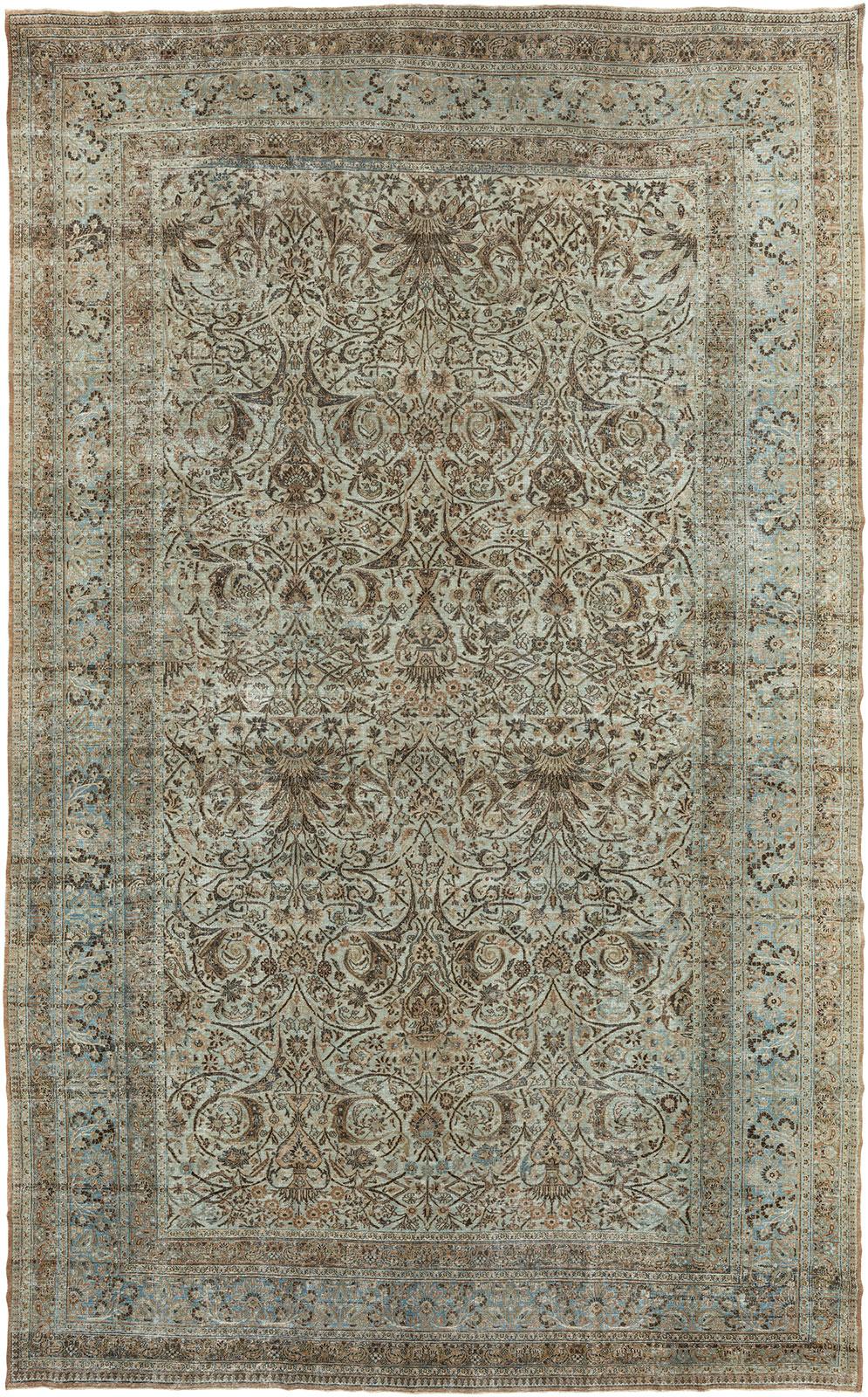 Beautifully worn oversize Persian Meshed rug from the early 20th century. Durable enough to endure heavy traffic if necessary.

Measures: 14' x 22'6''.

