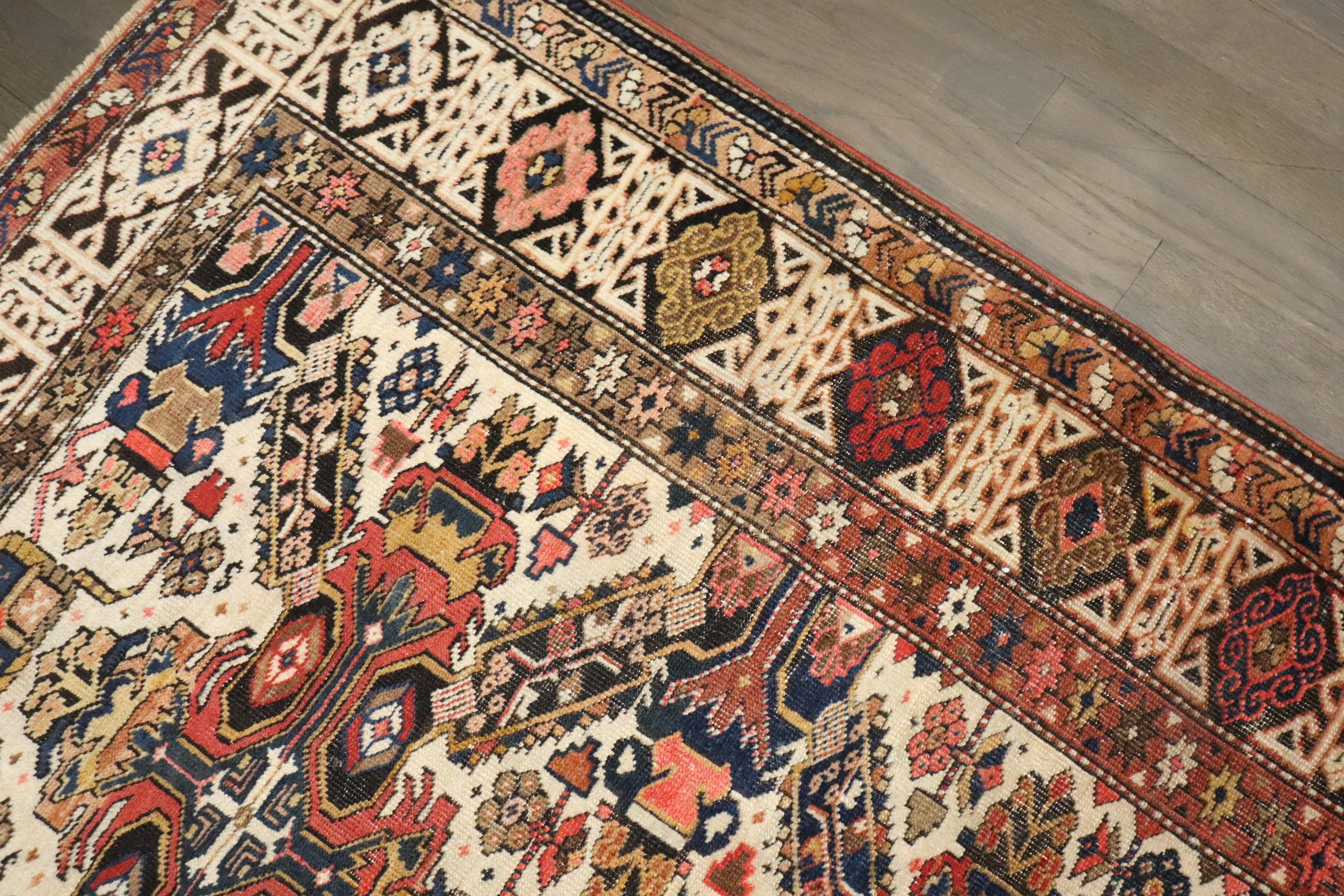 An early 20th-century Caucasian Zeychour Kuba rug.

Measures: 3'4'' x 4'9''

A subtype of the Kuba rug, antique Seychour (also known as Seichur and Zeychour) rugs are made in the small town of Yukhari-Zeykhur in Azerbaijan in the Northeast Caucasus.