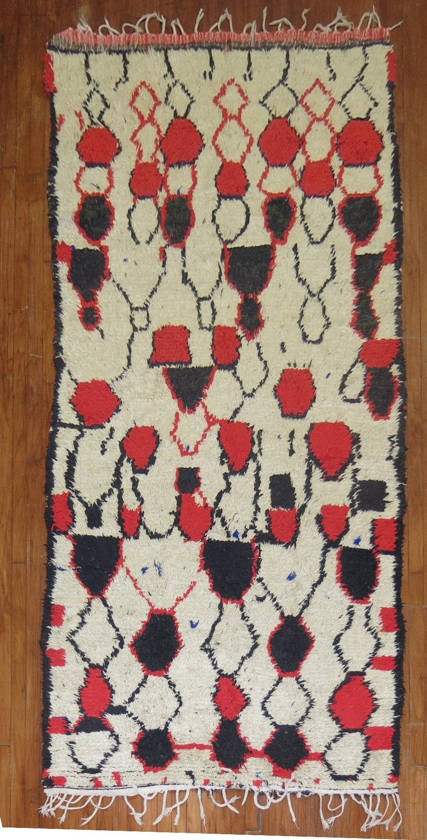 A one-of-a-kind Authentic Moroccan runner from the middle of the 20th century. This piece is pretty wild and fun. If you are in love take a dive and make a big splash!

size 4' 6