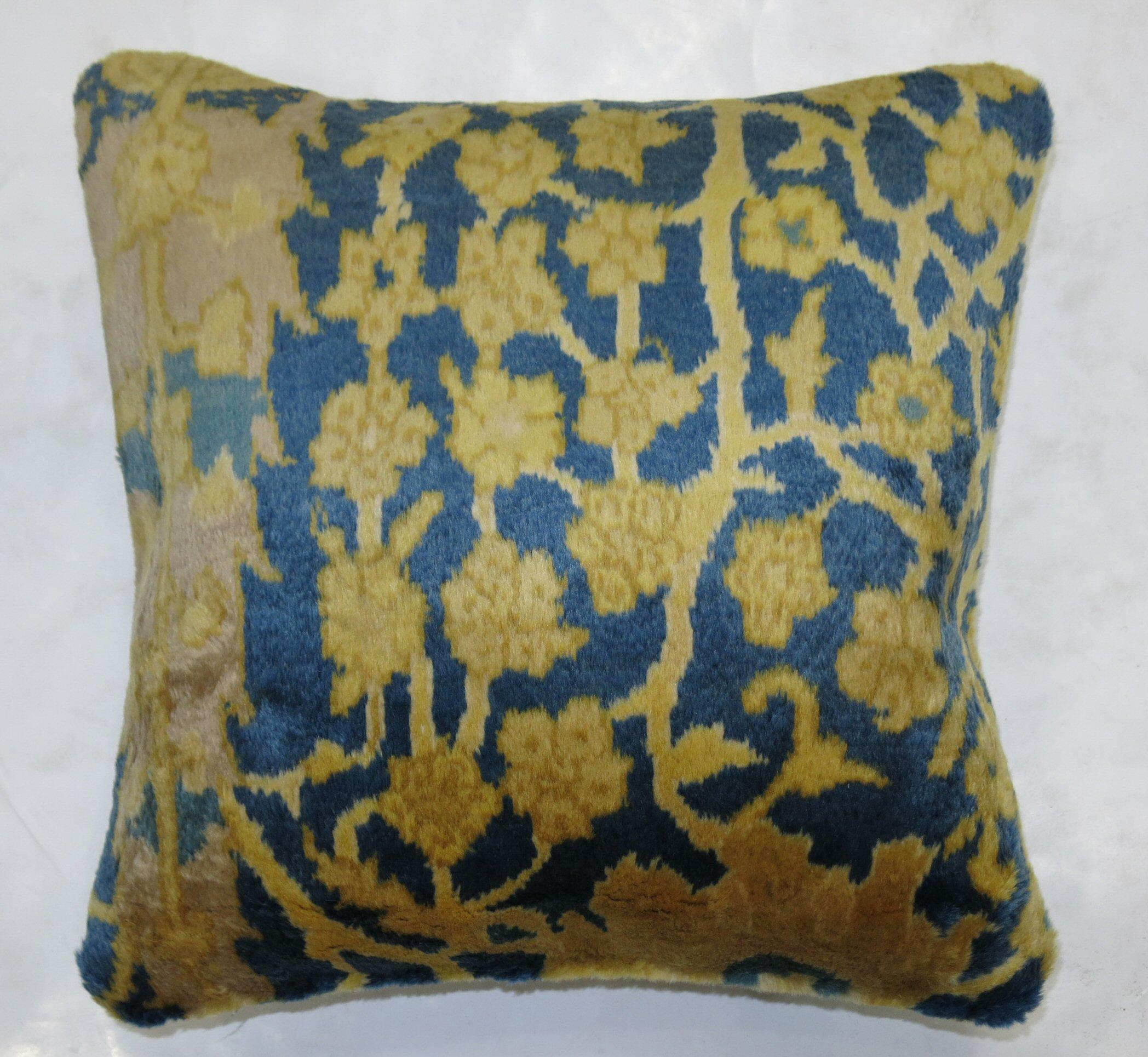 Pillow made from a vintage Indian Agra rug featuring fluffy wool in blue and gold. zipper closure and poly fill insert provided

Measures 16'' x 16'' square.