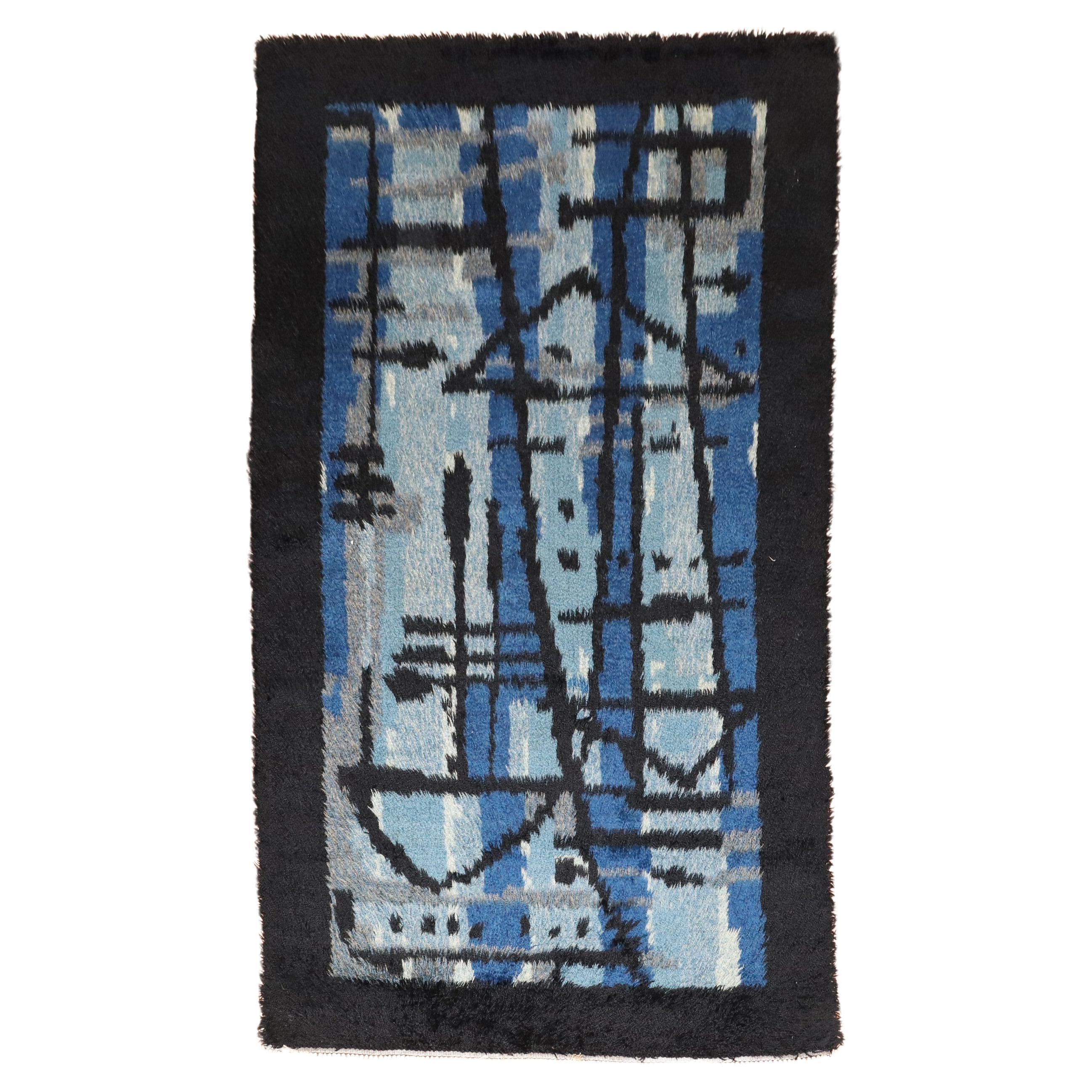 Mini alfombra sueca azul Rya de la colección Zabihi