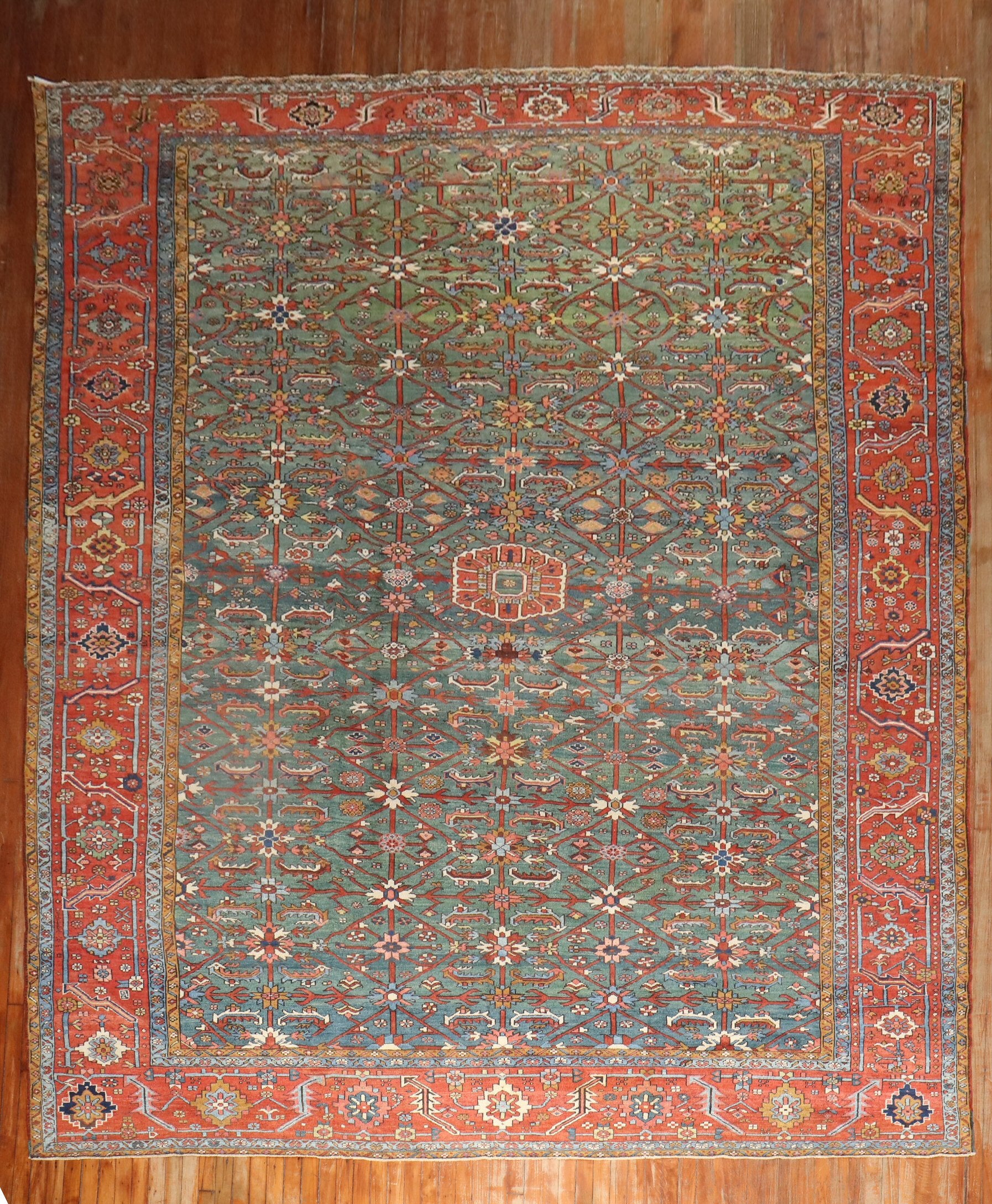 Large room size 1st quarter of the 20th century Persian heriz rug featuring a breathtaking emerald green field colro

Measures: 1011