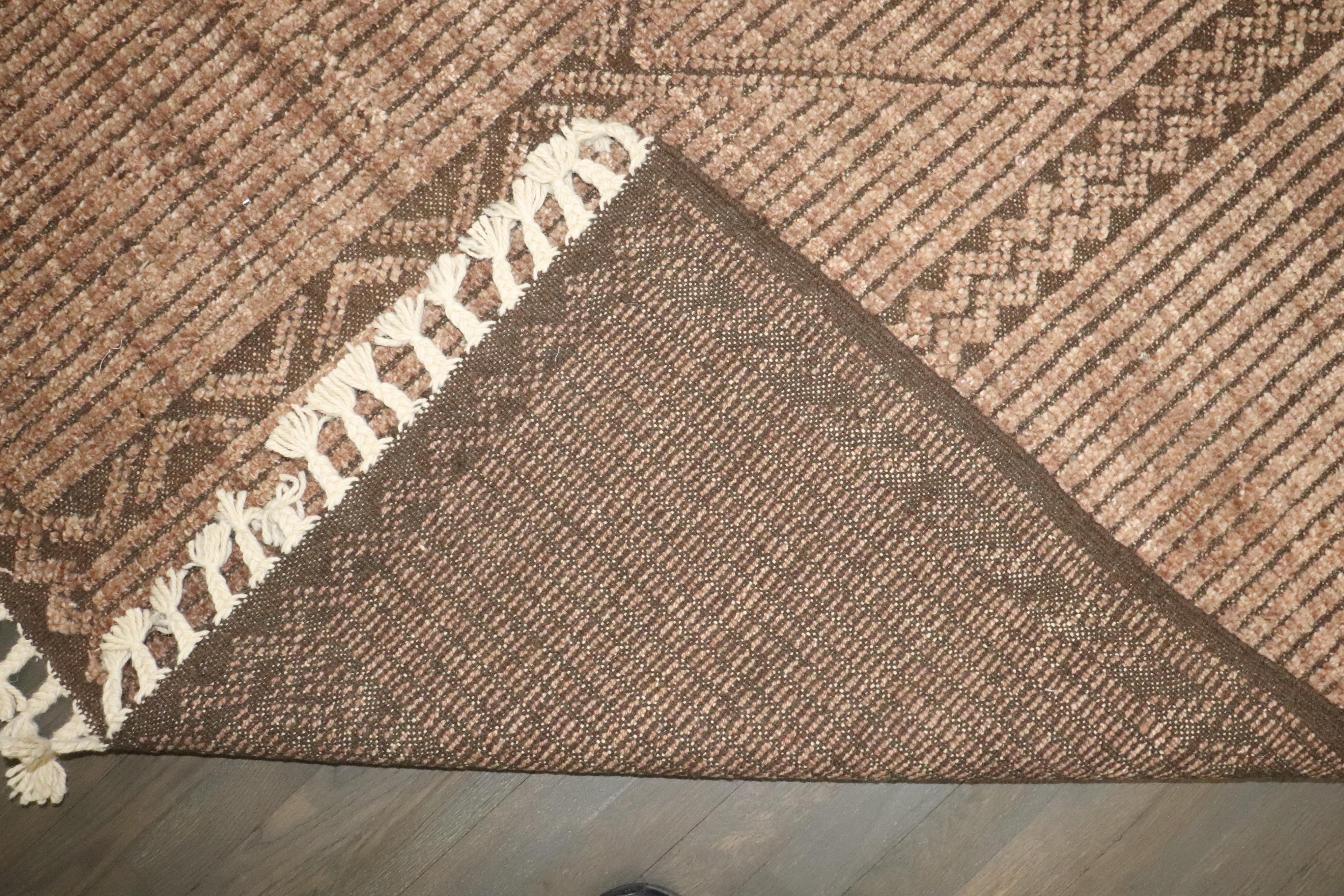 A contemporary all wool Afghan room-size carpet handmade during the 21st century. African Tuareg carpets inspire the field pattern.

8'6'' x 10'3''