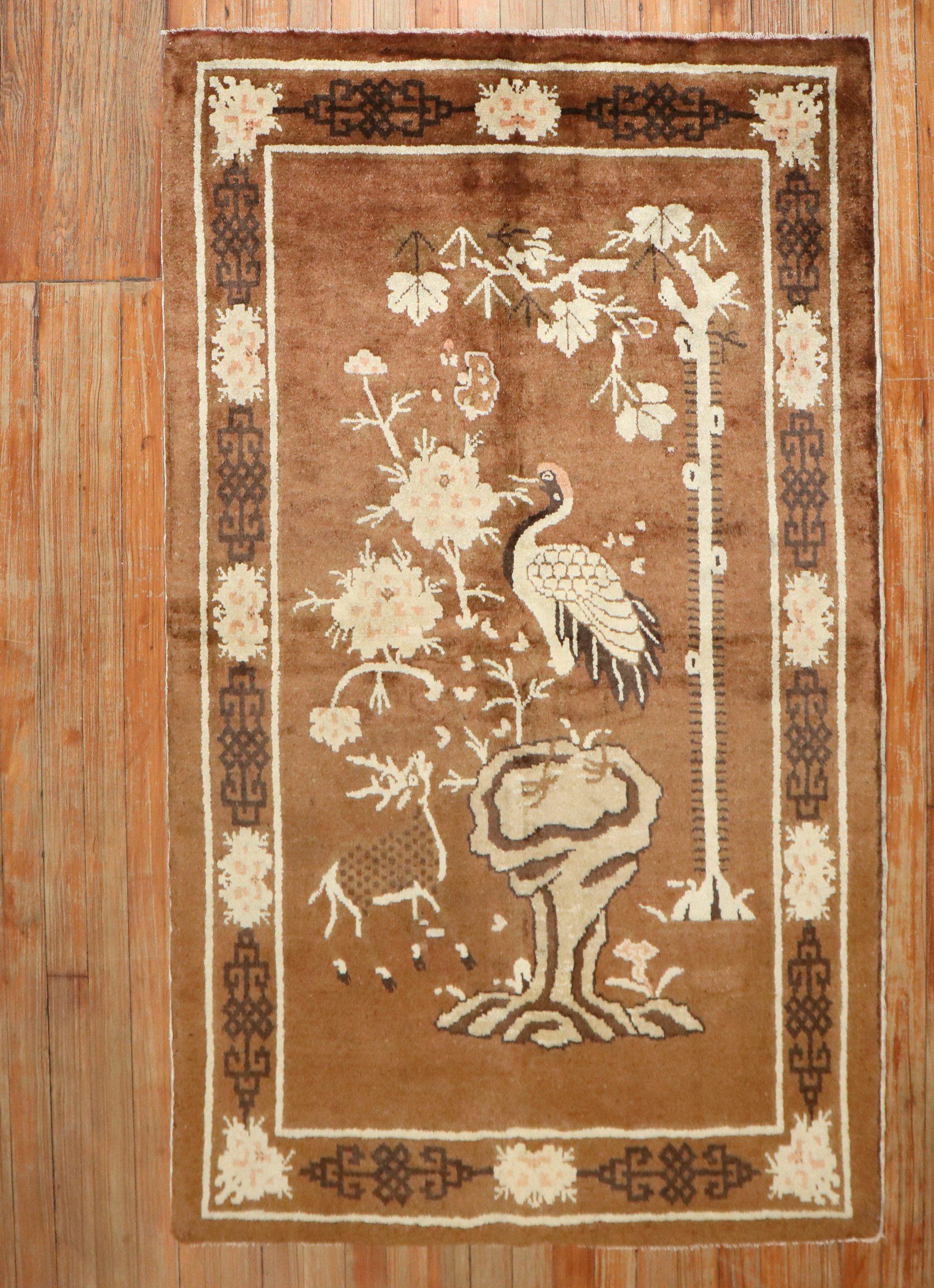 A 2nd quarter of the 20th-century Chinese Peking rug with a pictorial design in brown

Size: 3'3'' x 5'2''.


