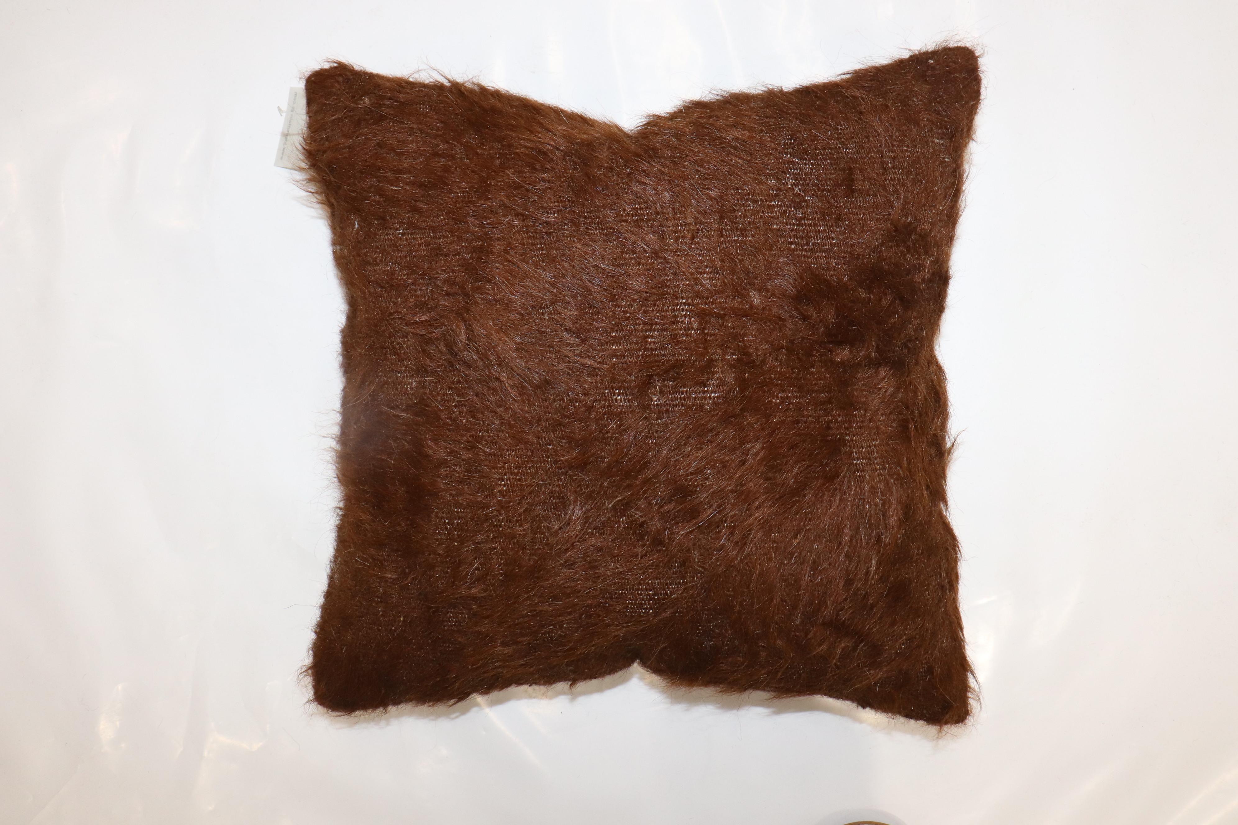 A small pillow made with a brown Turkish Mohair rug.

Measures: 15
