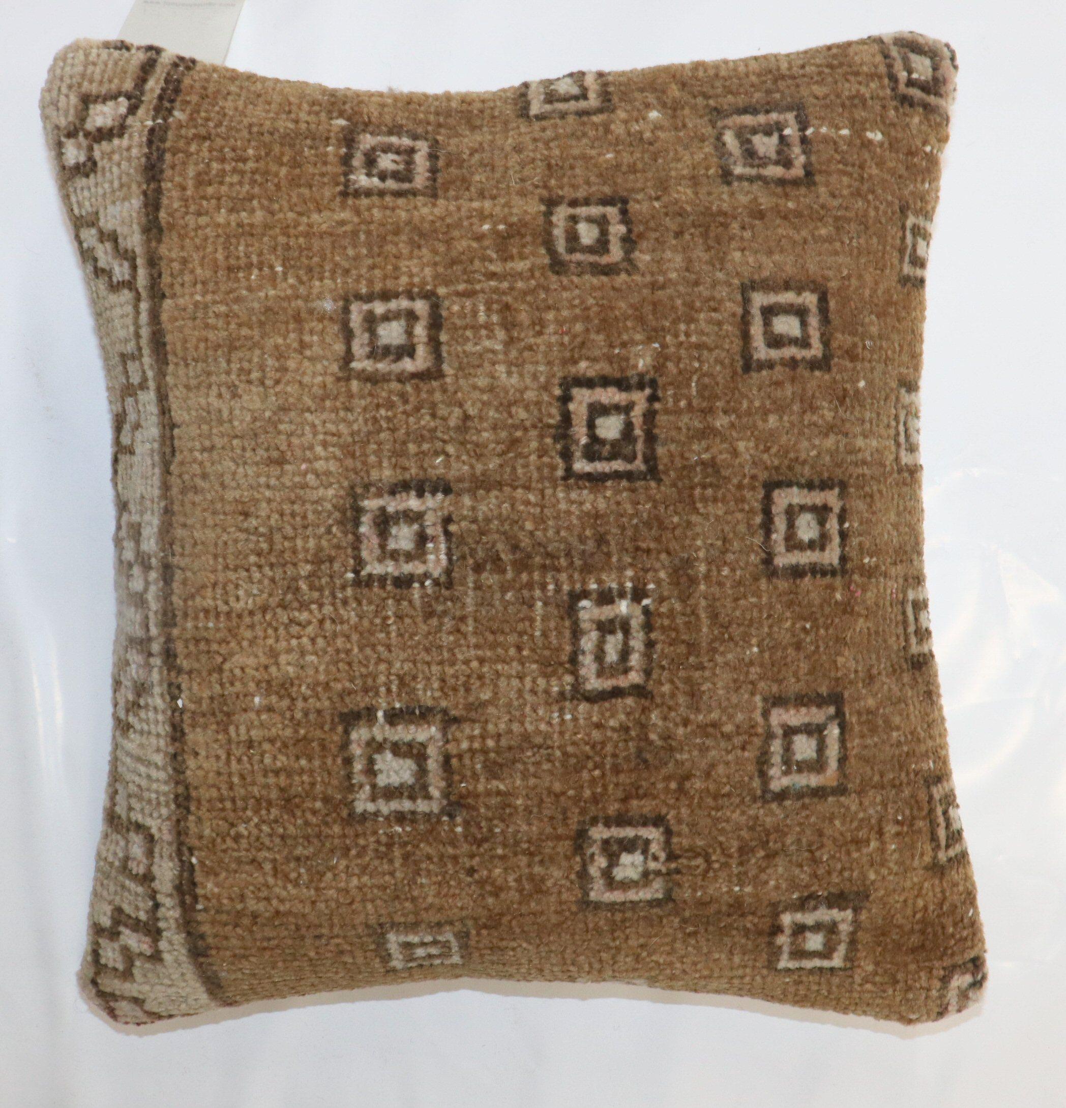 Pillow made from a vintage brown Turkish Kars rug

Measures: 16'' x 17''
