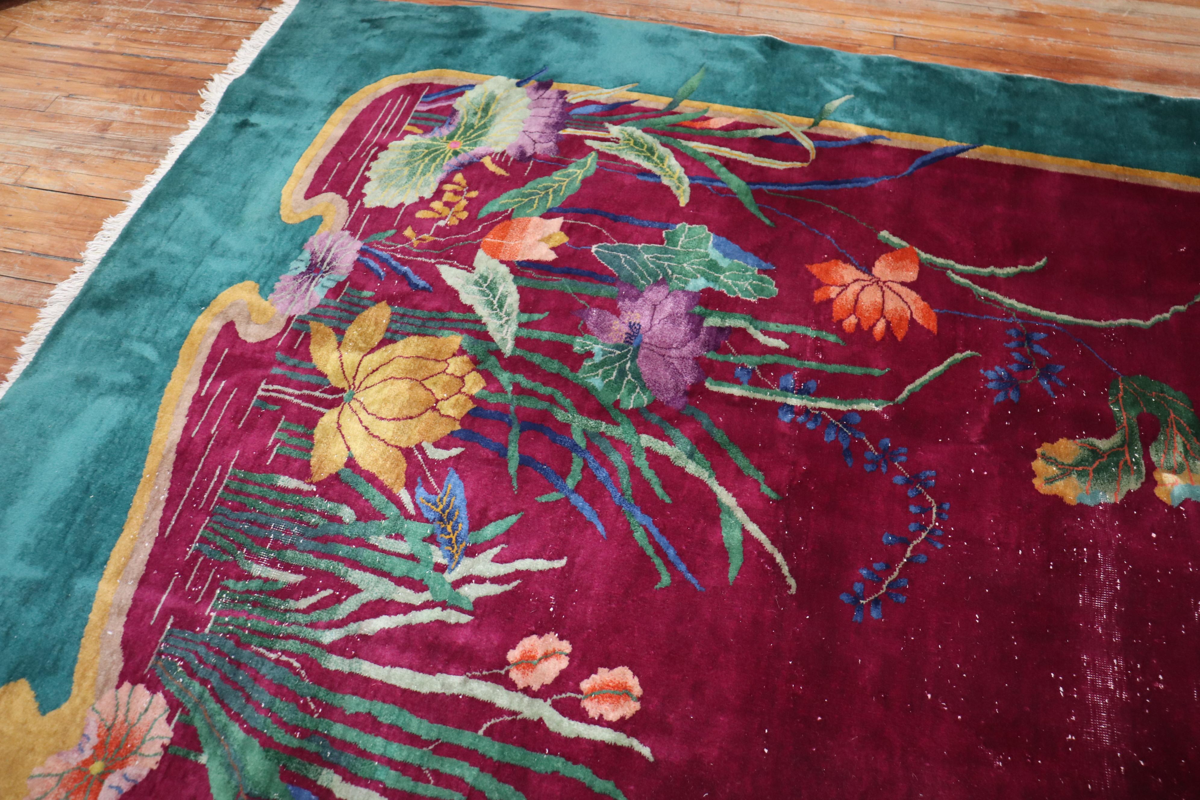 Enchanting Large room size 20th-century Chinese Art Deco carpet with a spacious floral design on a Burgundy Field

Measures: 9'10'' x 13'5''.