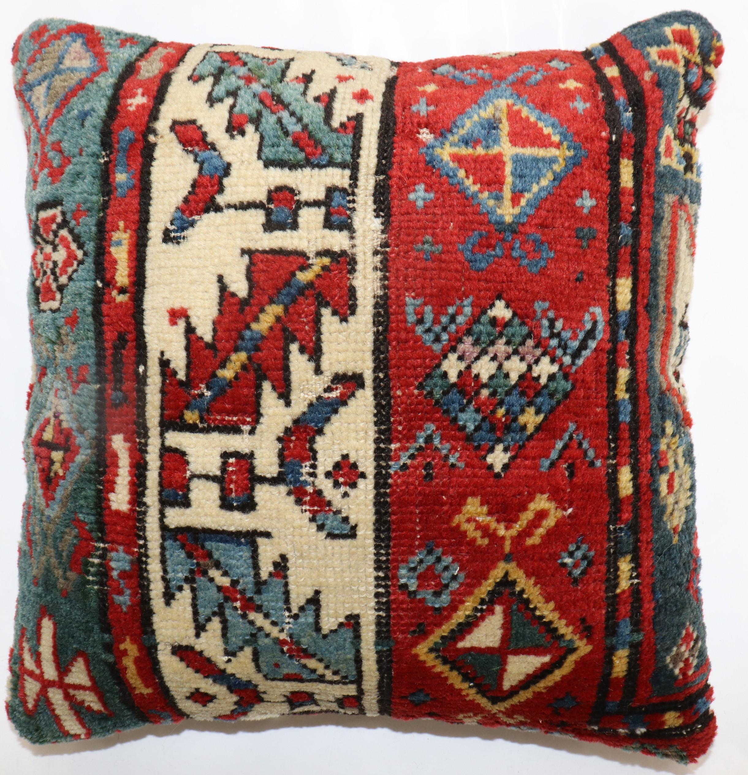Pillow made from an early 20th-century Caucasian rug. zipper closure and poly-fill insert provided.

Measures: 16