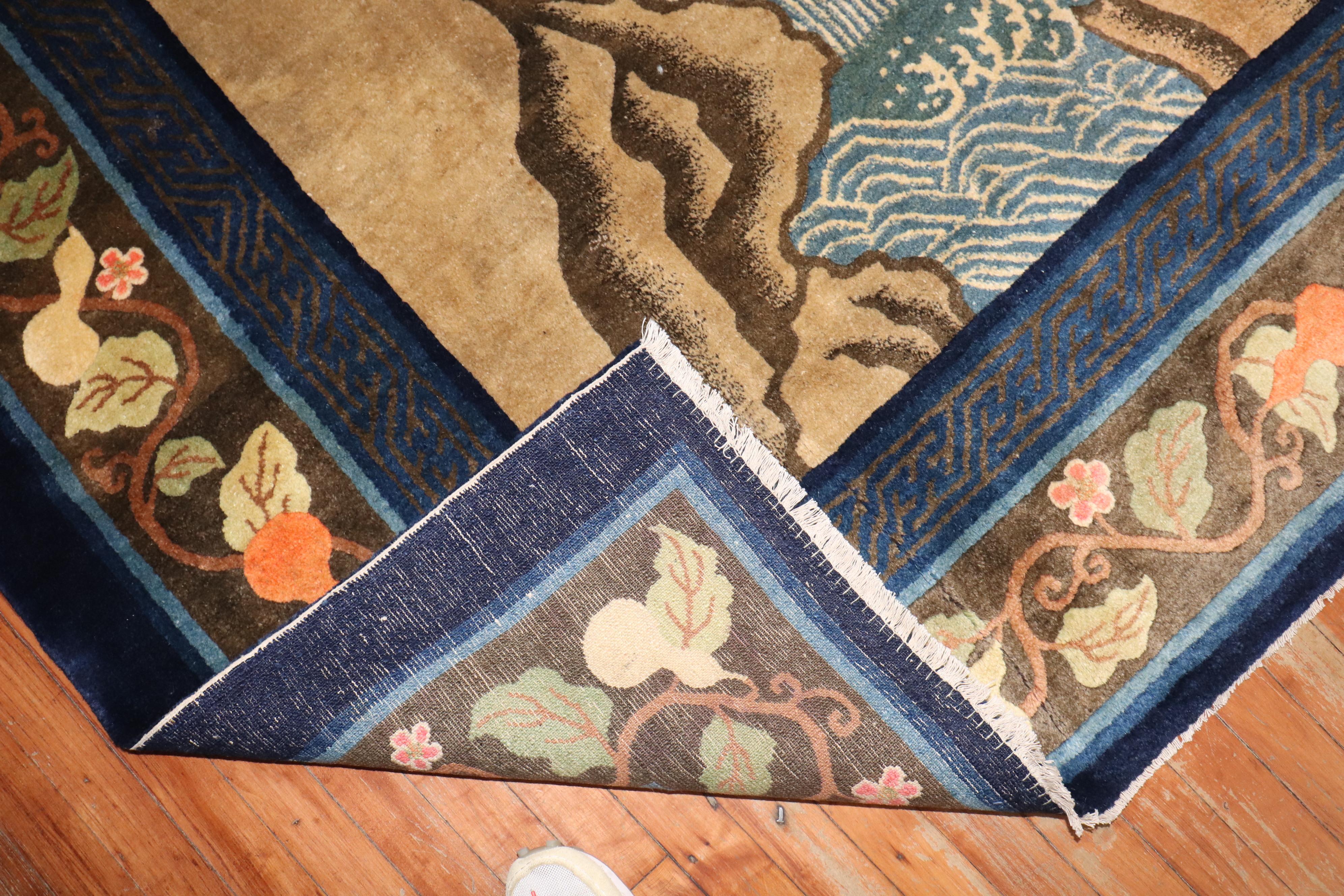An early 20th Century Chinese gallery-size rug with a landscaping scenic pictorial motif.

Measures: 6' x 12'3''