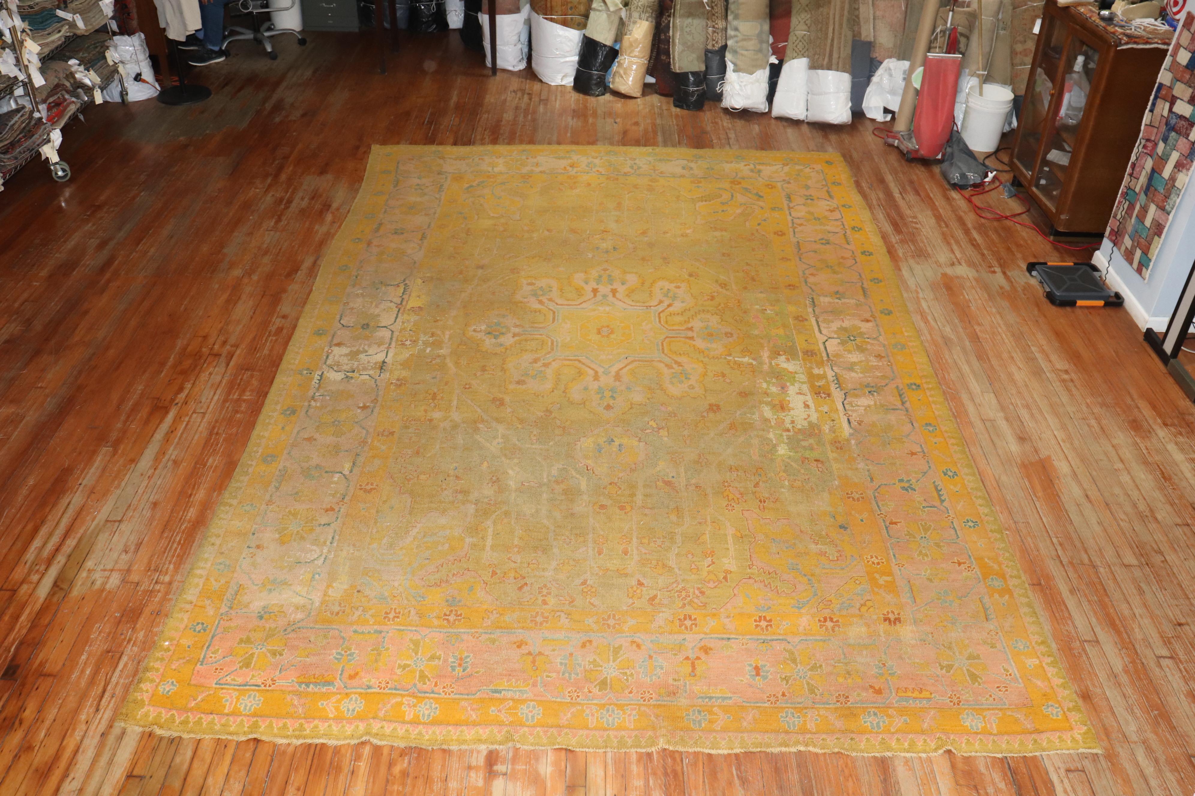Zabihi Collection Distressed Colorful Antique Turkish Oushak 19th Century Rug In Distressed Condition For Sale In New York, NY