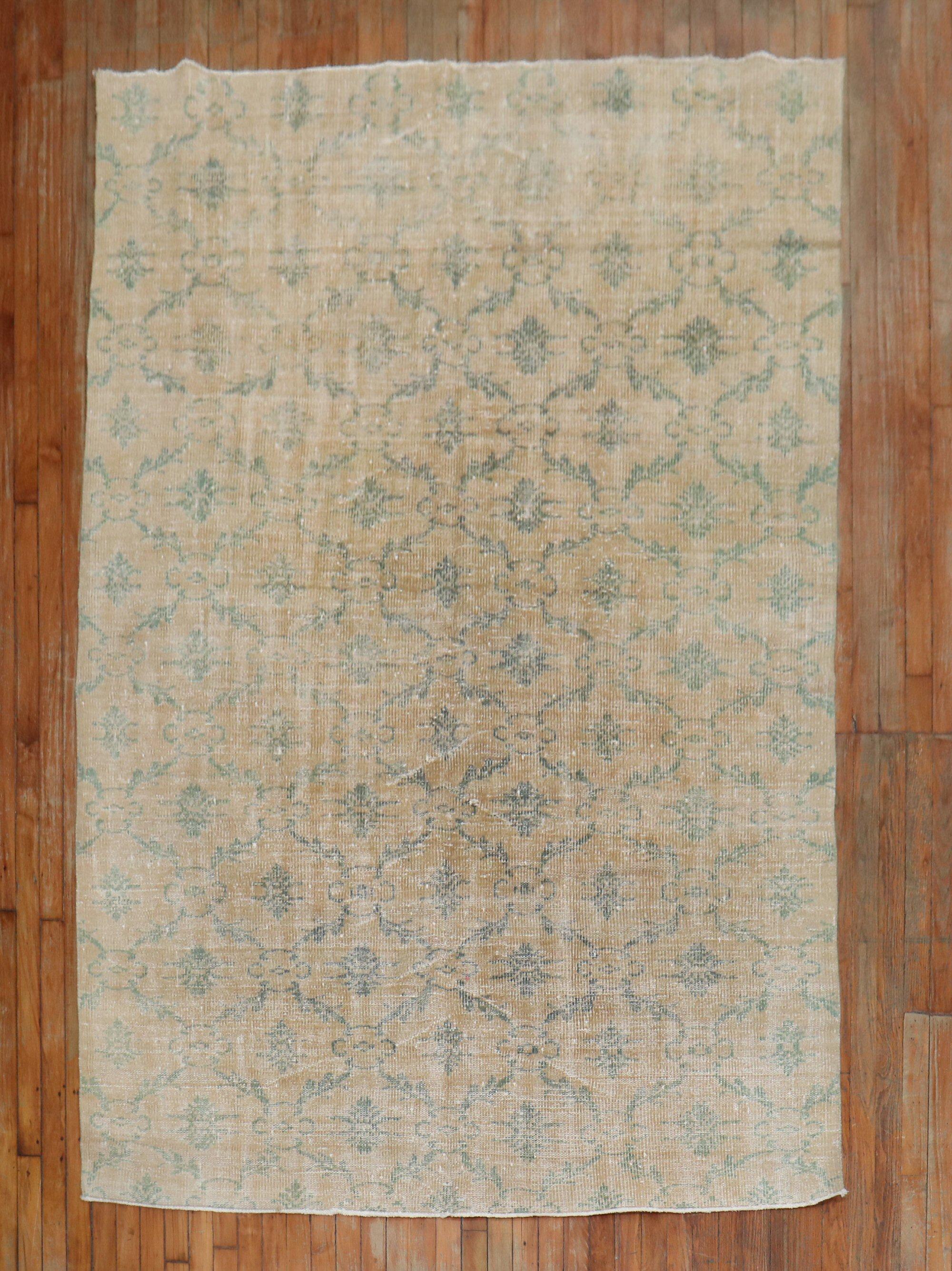 One of a kind Chic Distressed Mid 20th Century turkish rug with a repetitive borderless pattern in green on a bone colored field

Measures: 5'8'' x 8'11''
